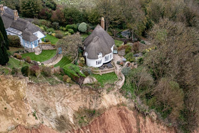 A cottage, sitting 10-metres from a cliff edge with a 400ft drop, following a small rockfall directly below and a significantly large cliff colapse a few hundred meters away, on a cliff top area between Sidmouth and Ladram Bay. Picture date: Saturday November 2, 2024.