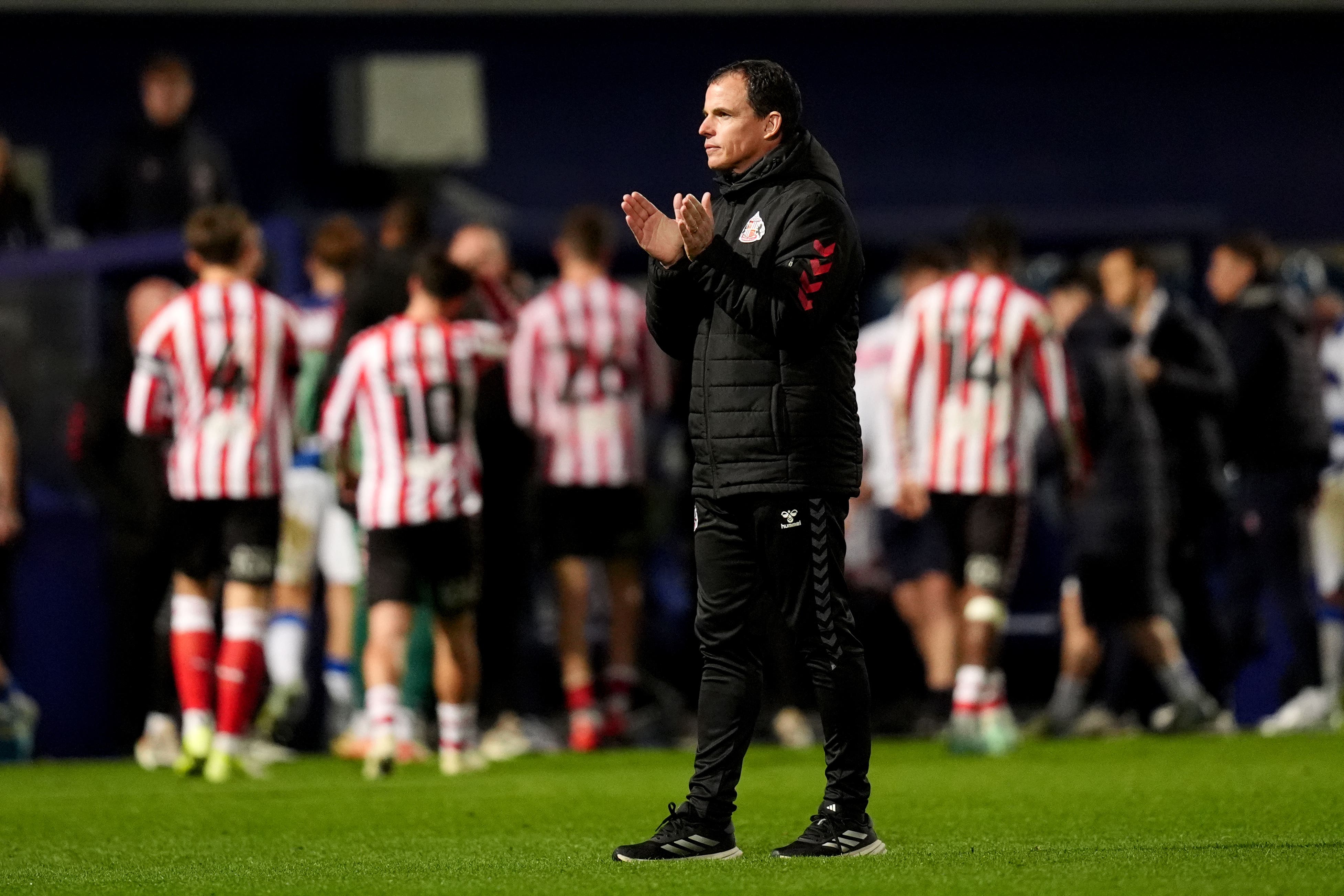 Sunderland manager Regis Le Bris applauds the fans at the end of the draw at QPR (PA)