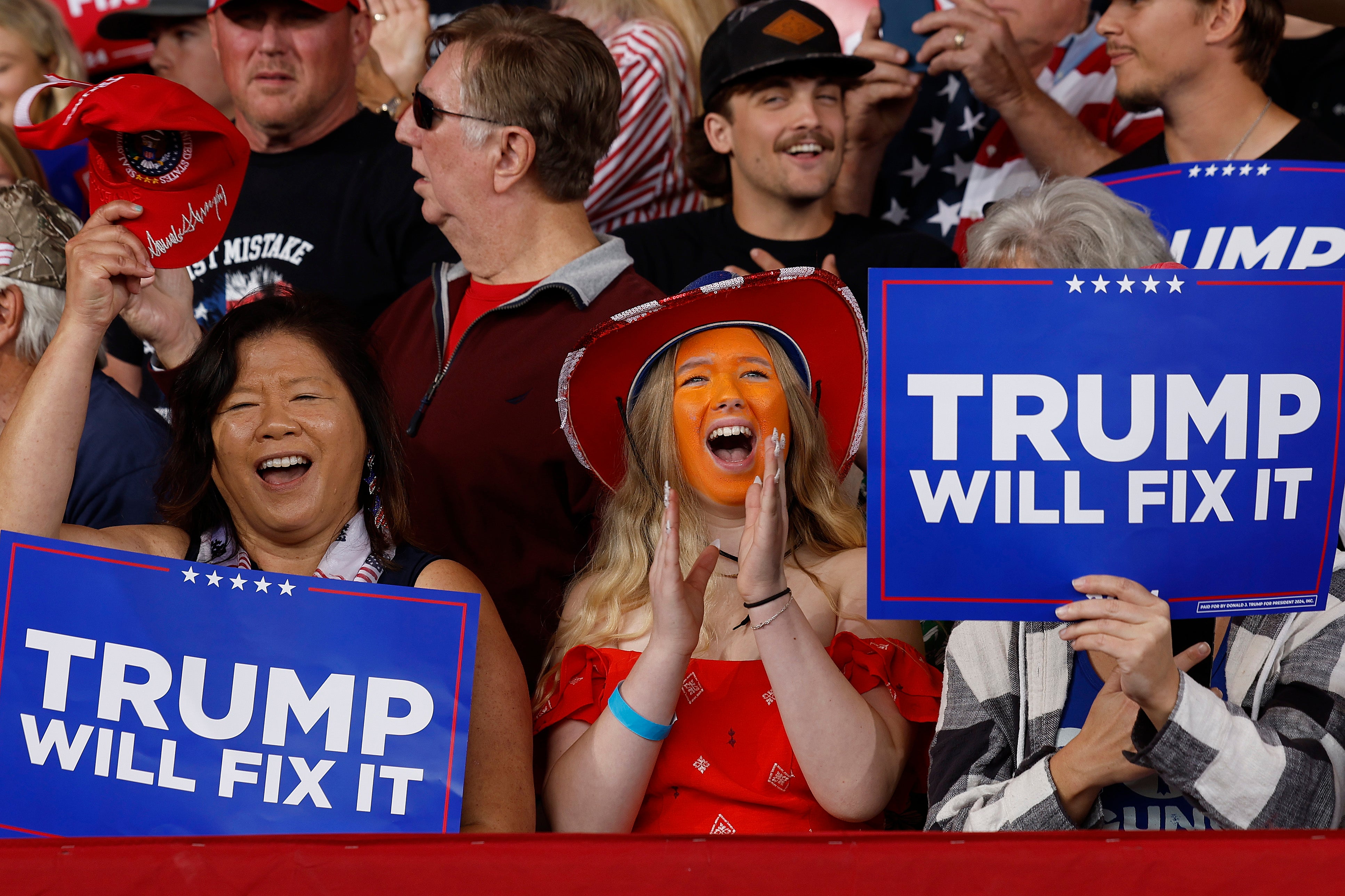 A Trump support in the Gastonia crowd sported a painted orange face