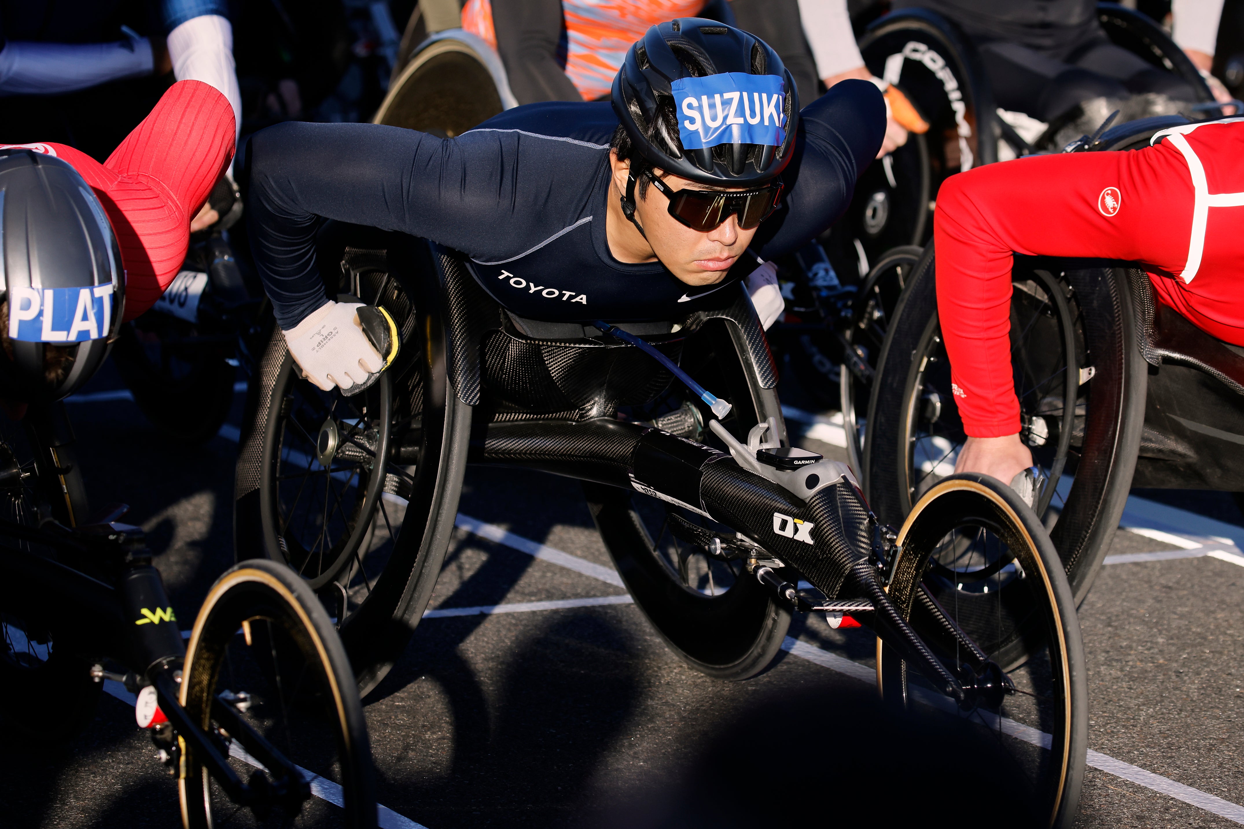 Tomoki Suzuki of Japan pushes off at the start of men's wheelchair race