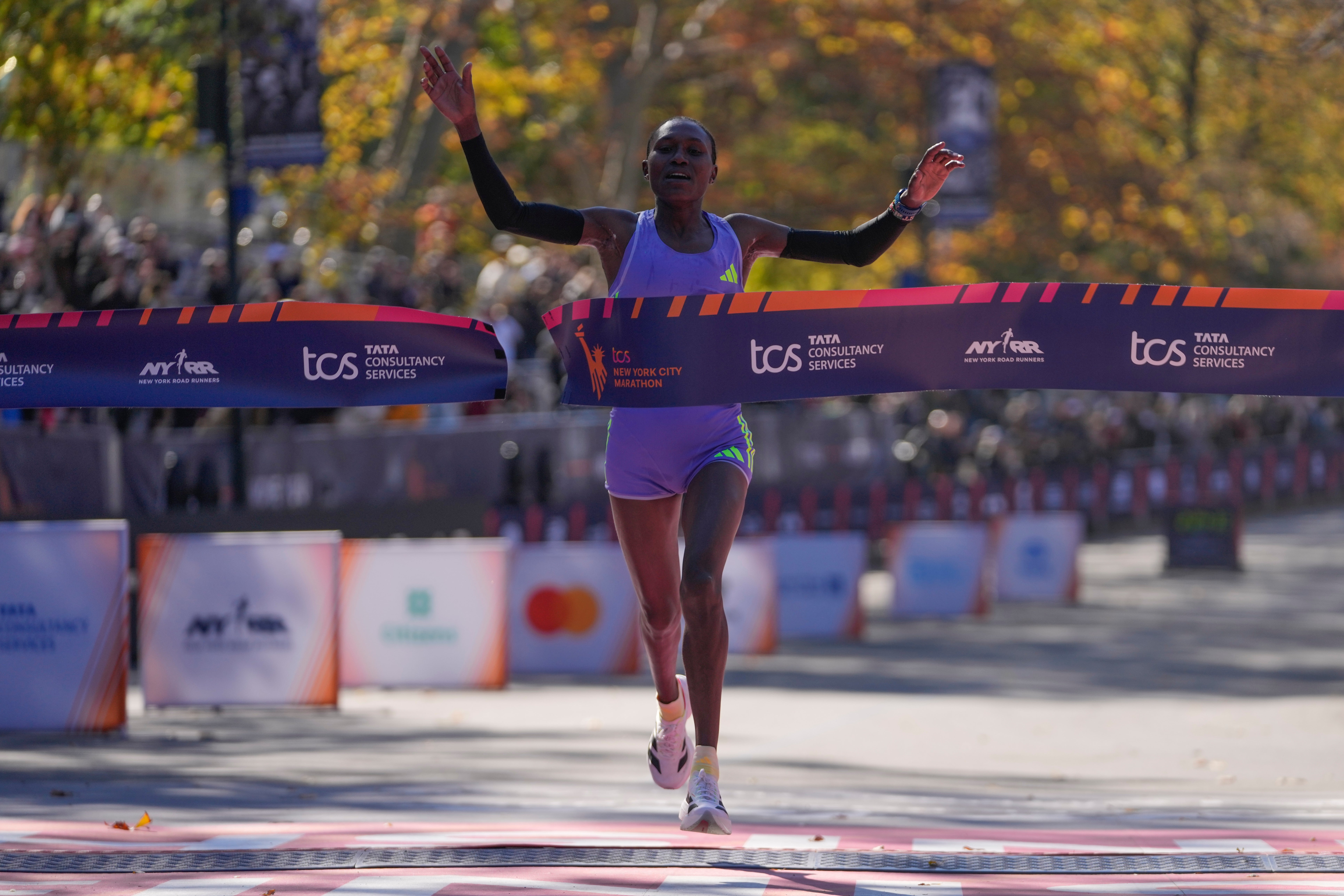 Sheila Chepkirui, 33, crosses the finish line at the New York City Marathon on Sunday