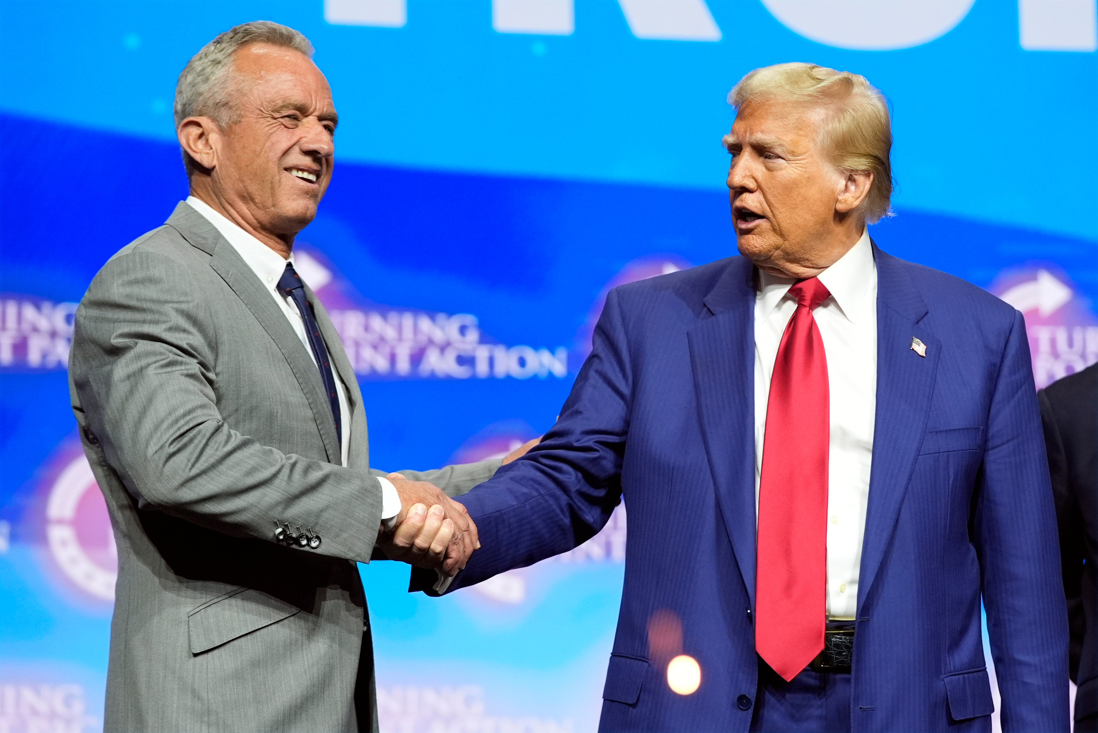 Republican presidential nominee former President Donald Trump shakes hands with Robert F. Kennedy Jr. during a rally in Duluth, Georgia, last month. Kennedy said over the weekend he would ‘advise all US water systems to remove fluoride from public water.’