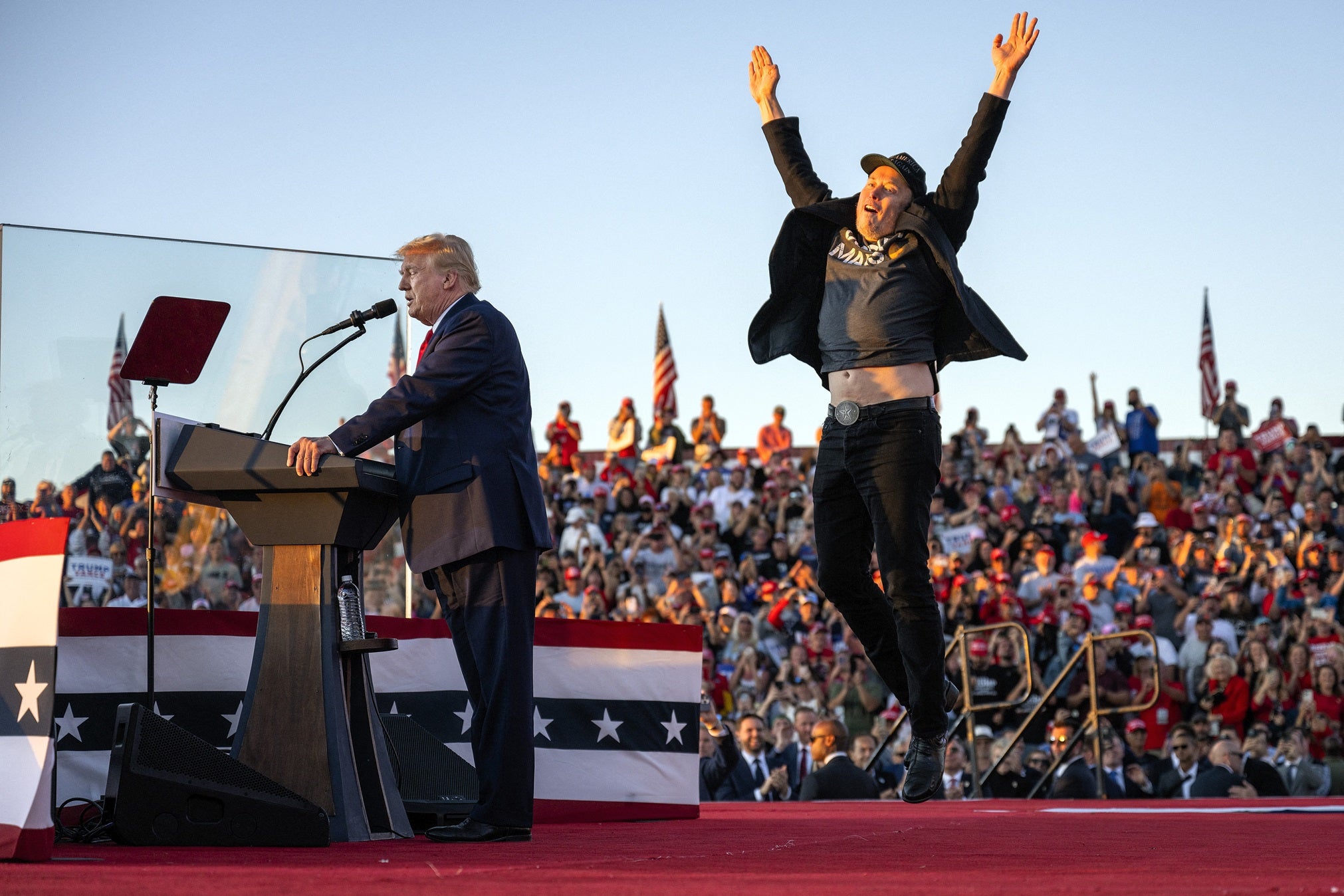 Elon Musk jumps on stage as he joins former US President and convicted felon Donald Trump during a campaign rally in Butler, Pennsylvania on 5 October, 2024