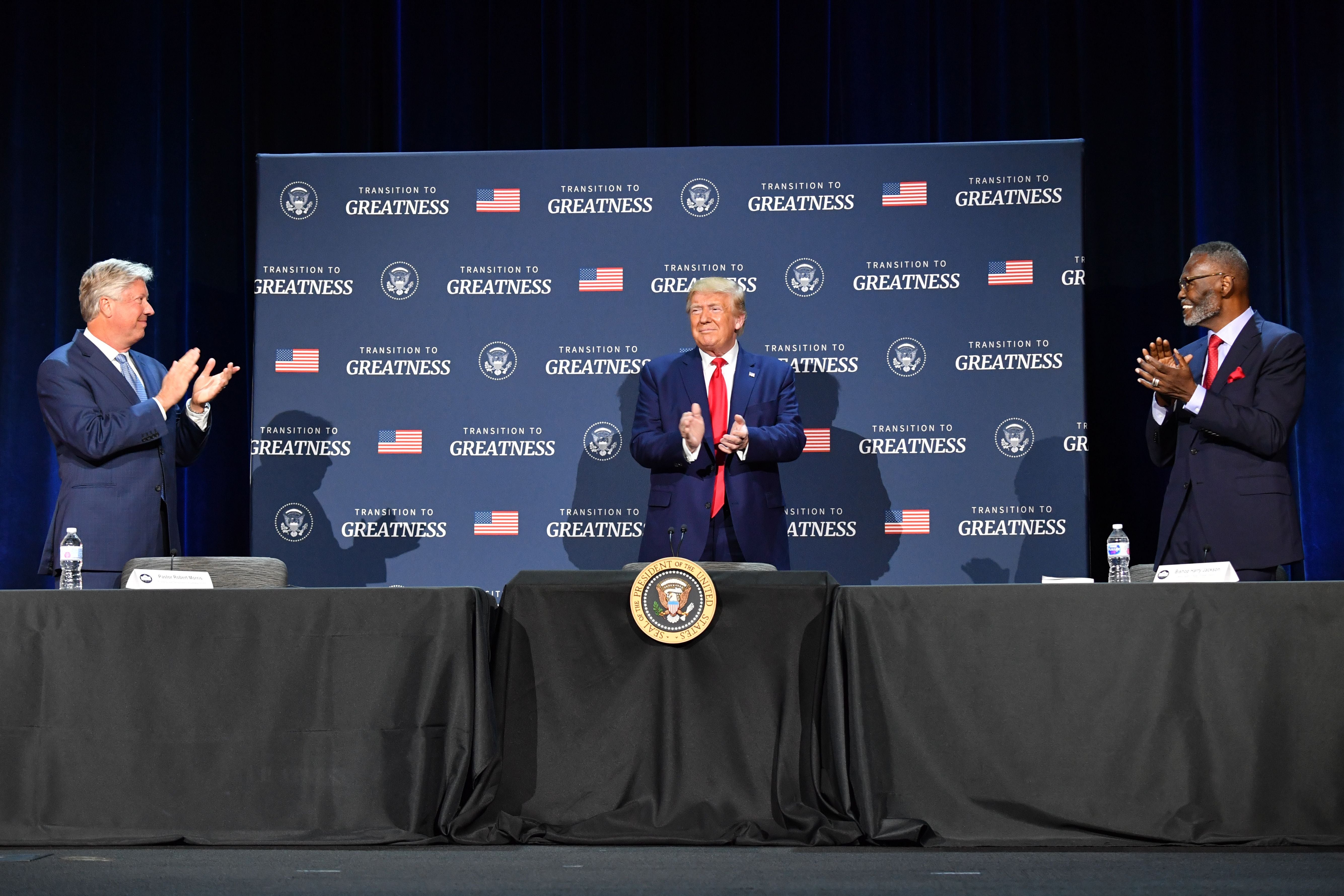 Morris (left), founder of a Texas megachurch and former religious advisor to Trump (center), stands with the former president in 2020. Morris resigned from the church he founded in June after admitting to ‘inappropriate sexual behavior’ with a 12-year-old girl