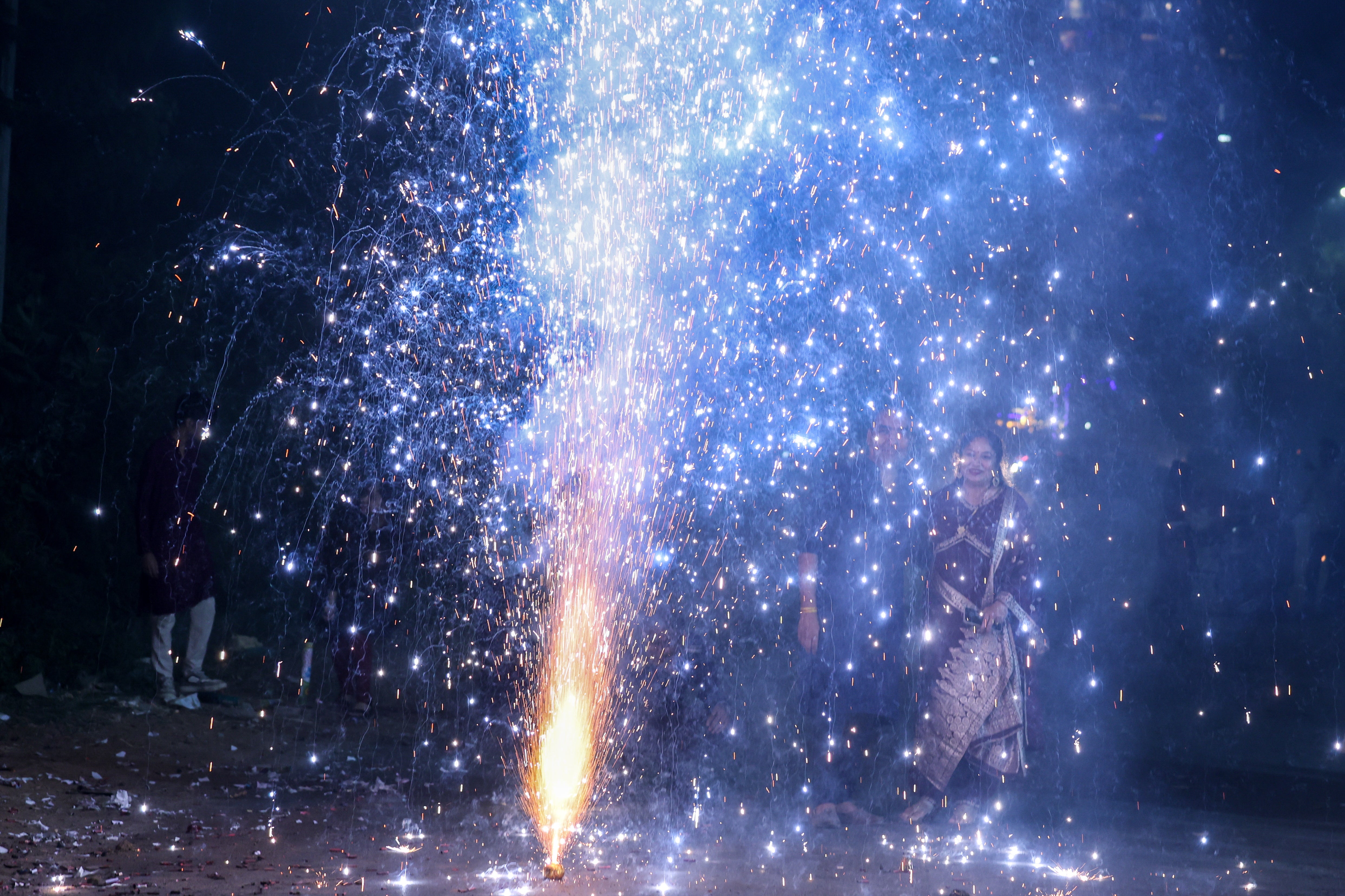 People light firecrackers on the occasion of the Diwali festival in Ahmedabad, India, 31 October 2024