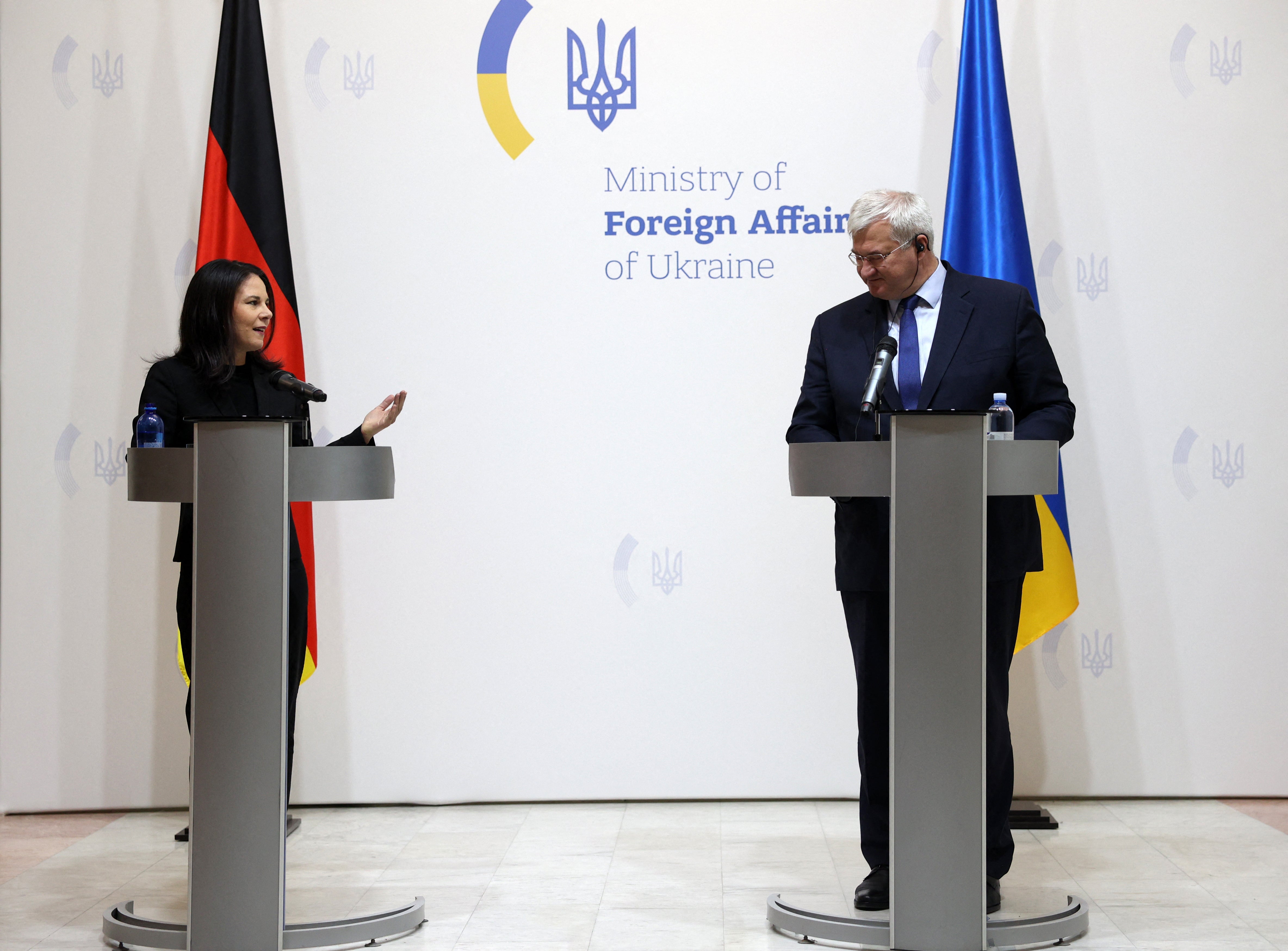 Annalena Baerbock looks at her Ukrainian counterpart Andrii Sybiha in Kyiv during a news conference