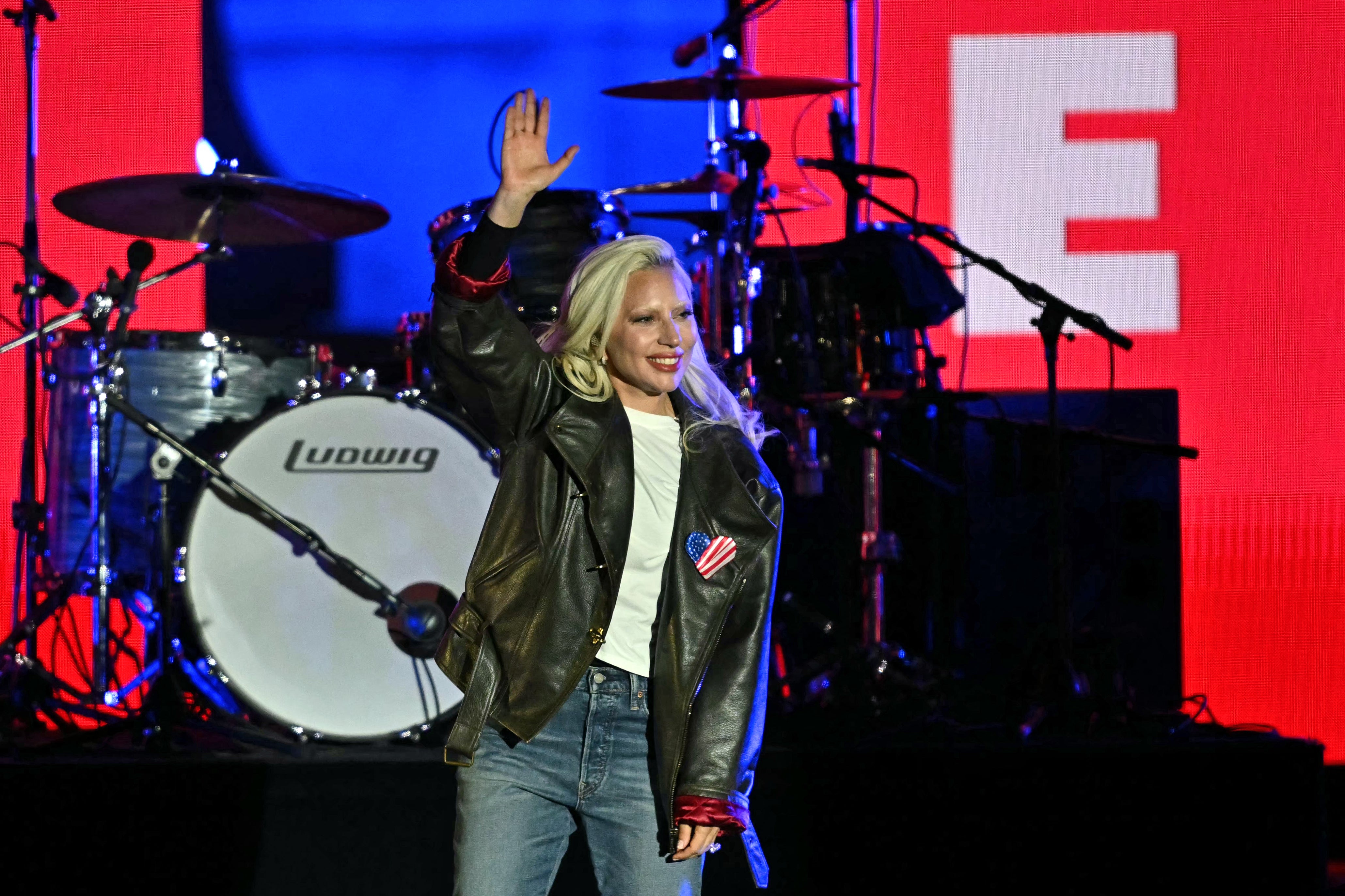 US singer Lady Gaga waves before performing during a campaign rally by US Vice President and Democratic presidential candidate Kamala Harris speaks the Benjamin Franklin Parkway in Philadelphia, Pennsylvania