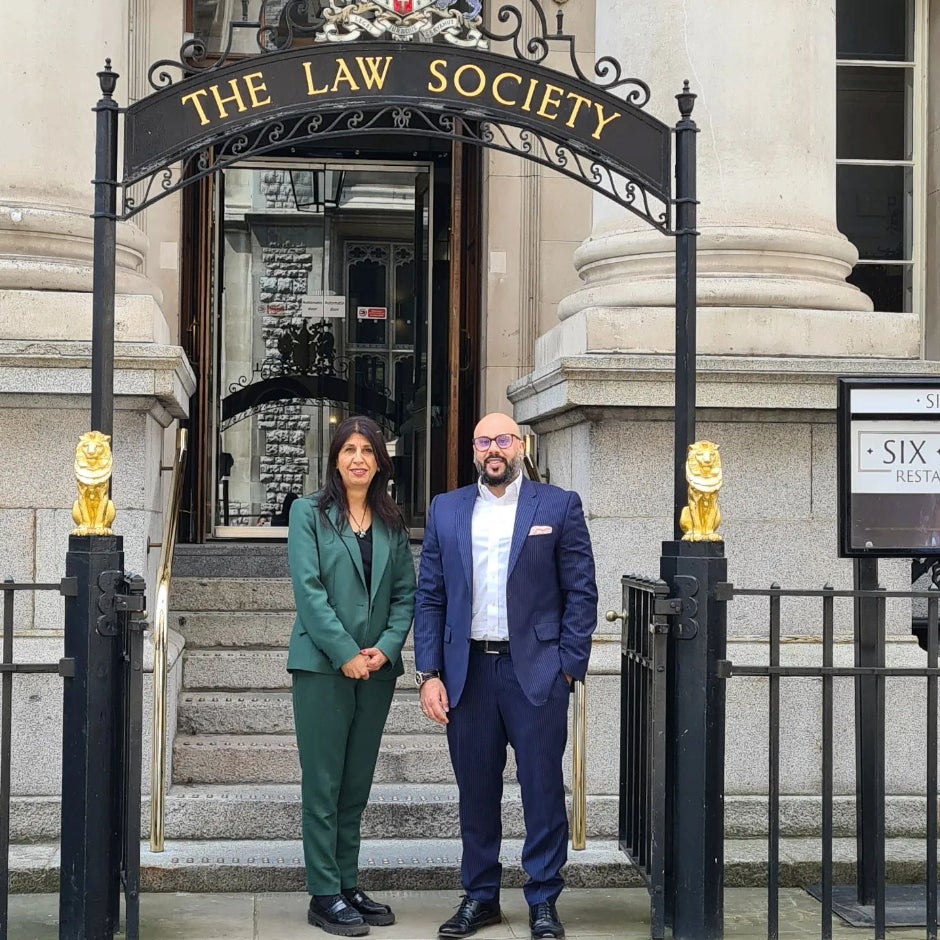 Simarjot standing with Lubna Shuja, who was the president of the Law Society of England and Wales