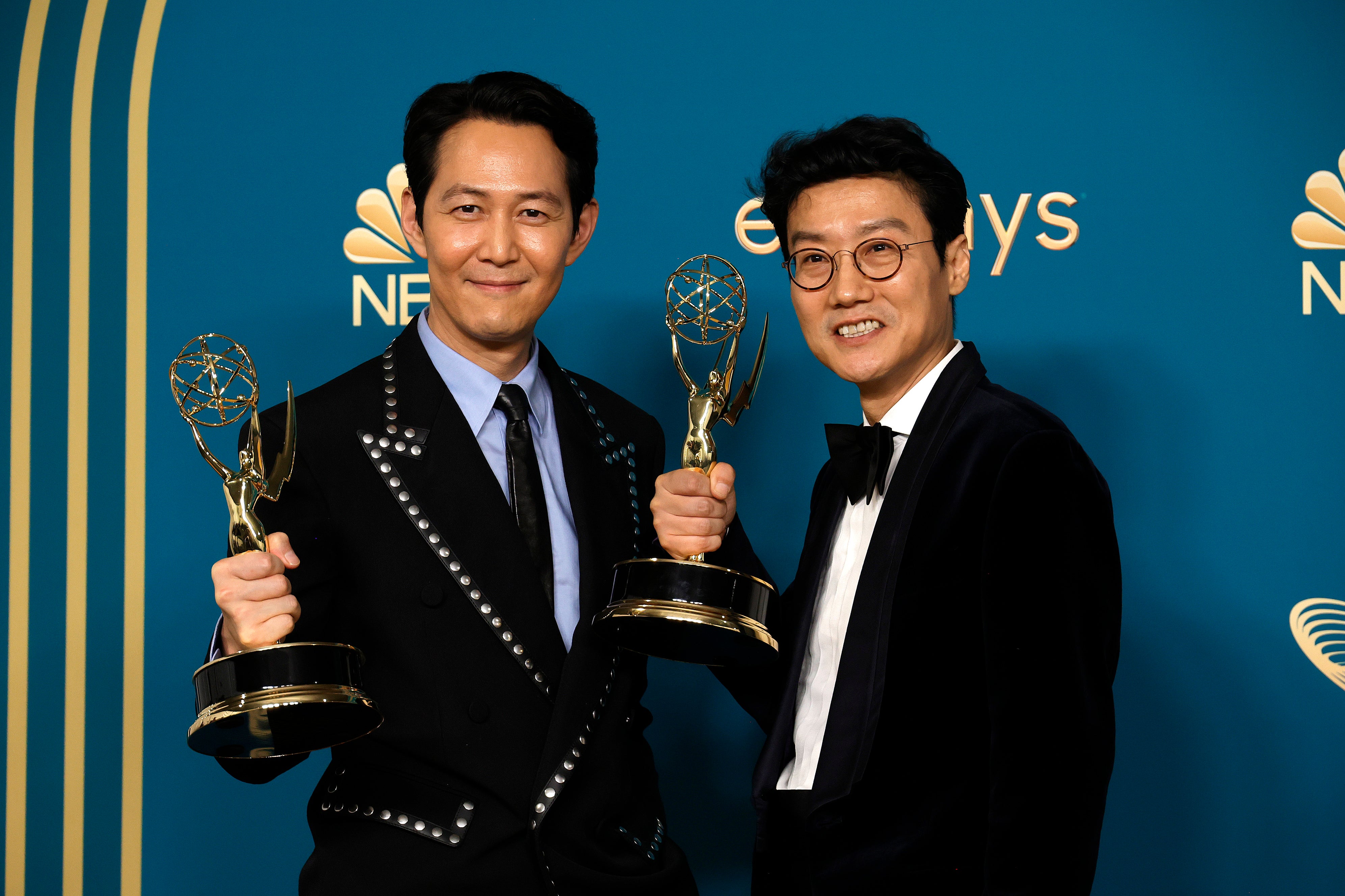 Lee Jung-jae and Hwang Dong-hyuk with their awards at the 4th Primetime Emmys in 2022