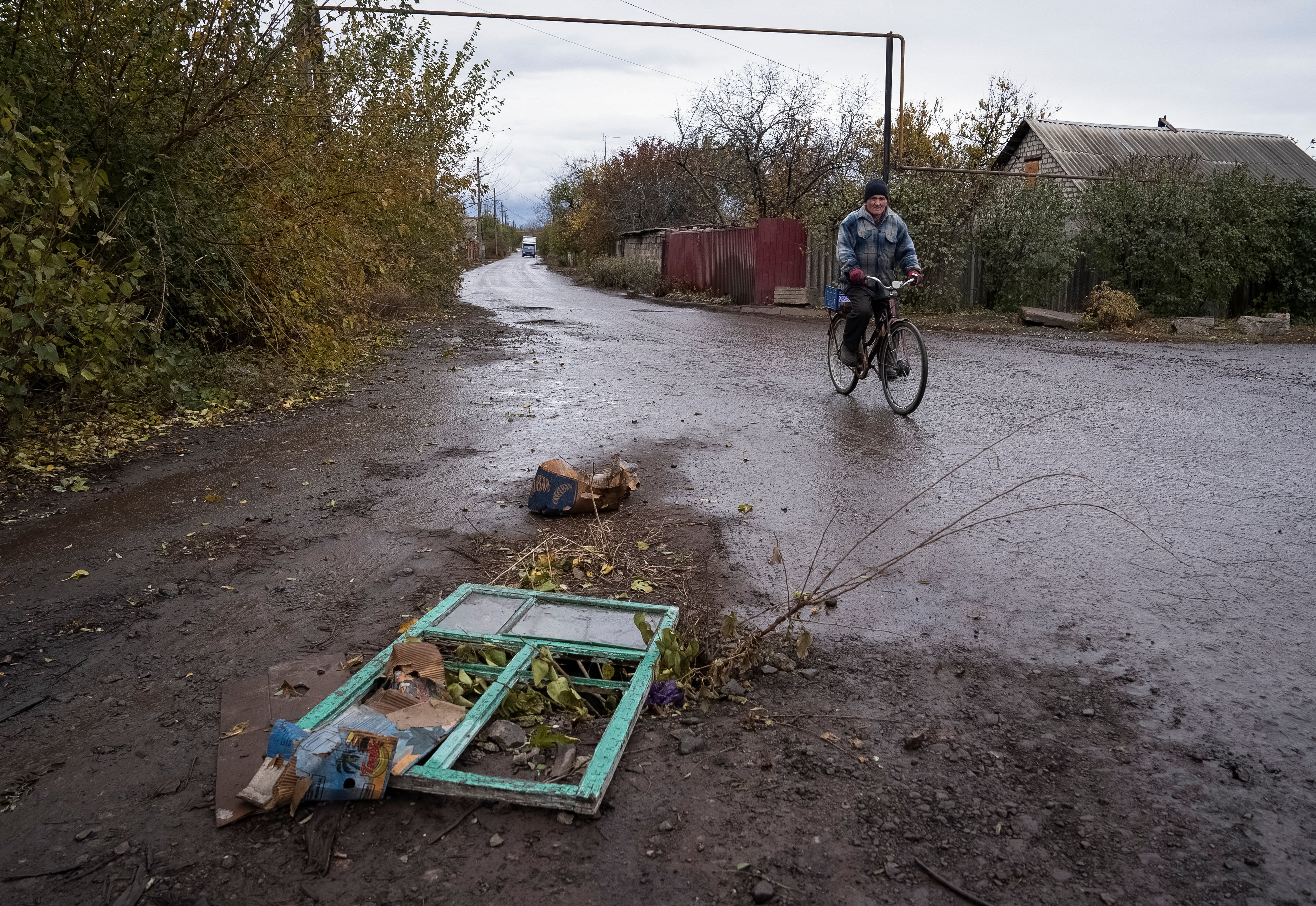 A resident rides a bicycle, amid Russia's attack on Ukraine, in the town of Pokrovsk in Donetsk region, Ukraine