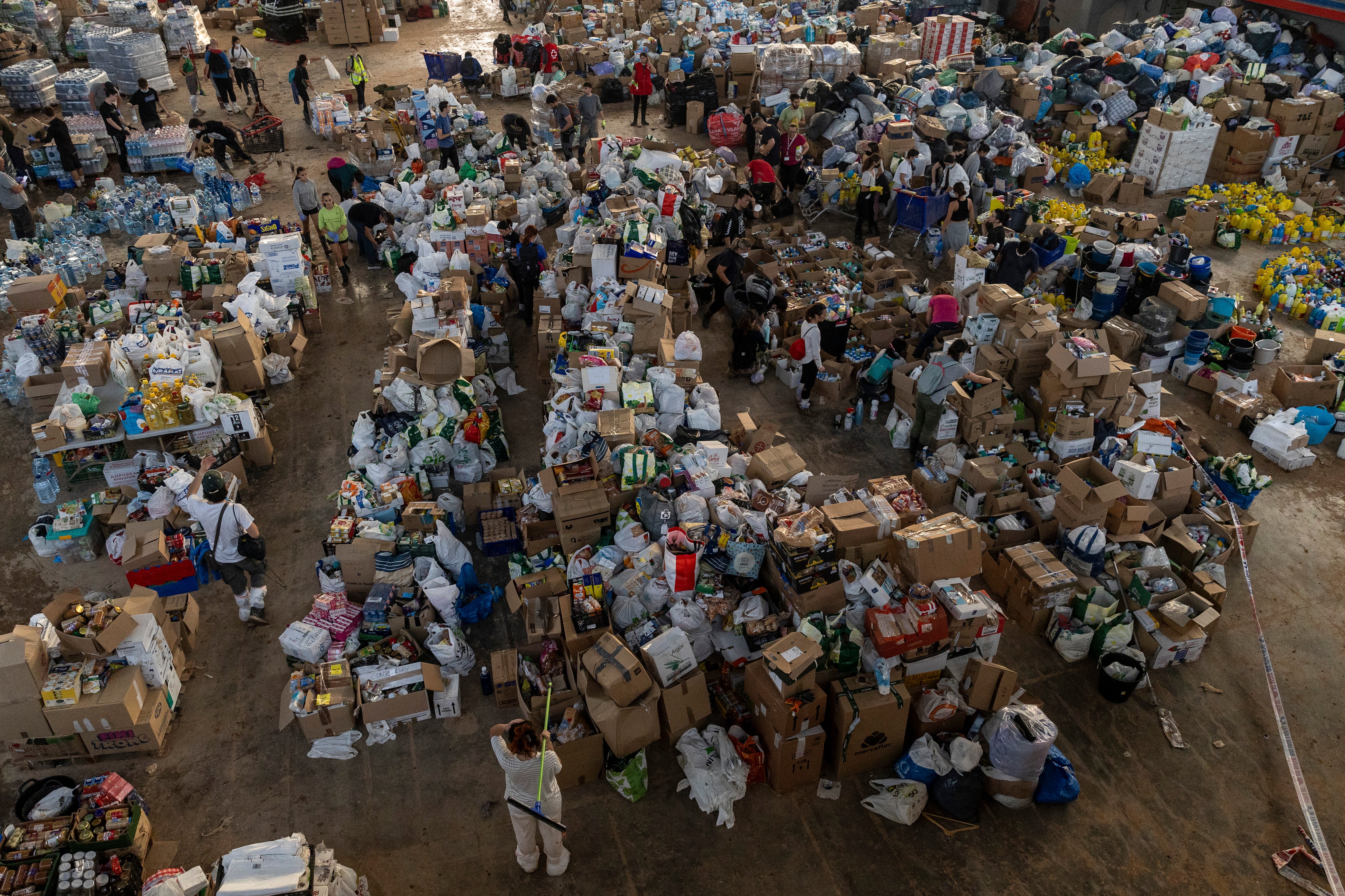 Volunteers prepare donations at a sport center after heavy rain and flooding hit large parts of the country on November 04, 2024 in Sedavi municipality, in Valencia, Spain