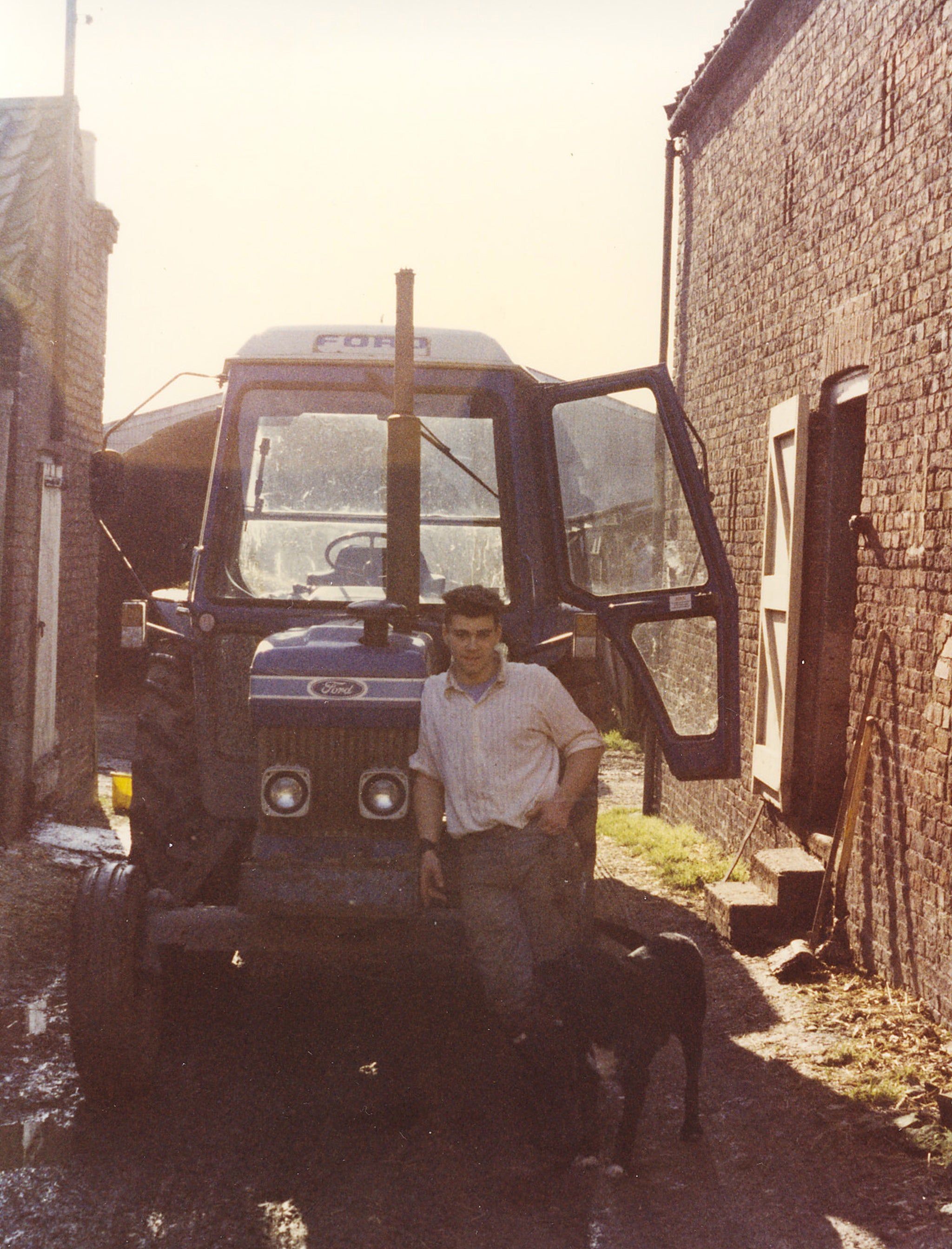 Richard’s brother, Guy, and the farm’s dog in the 1990s