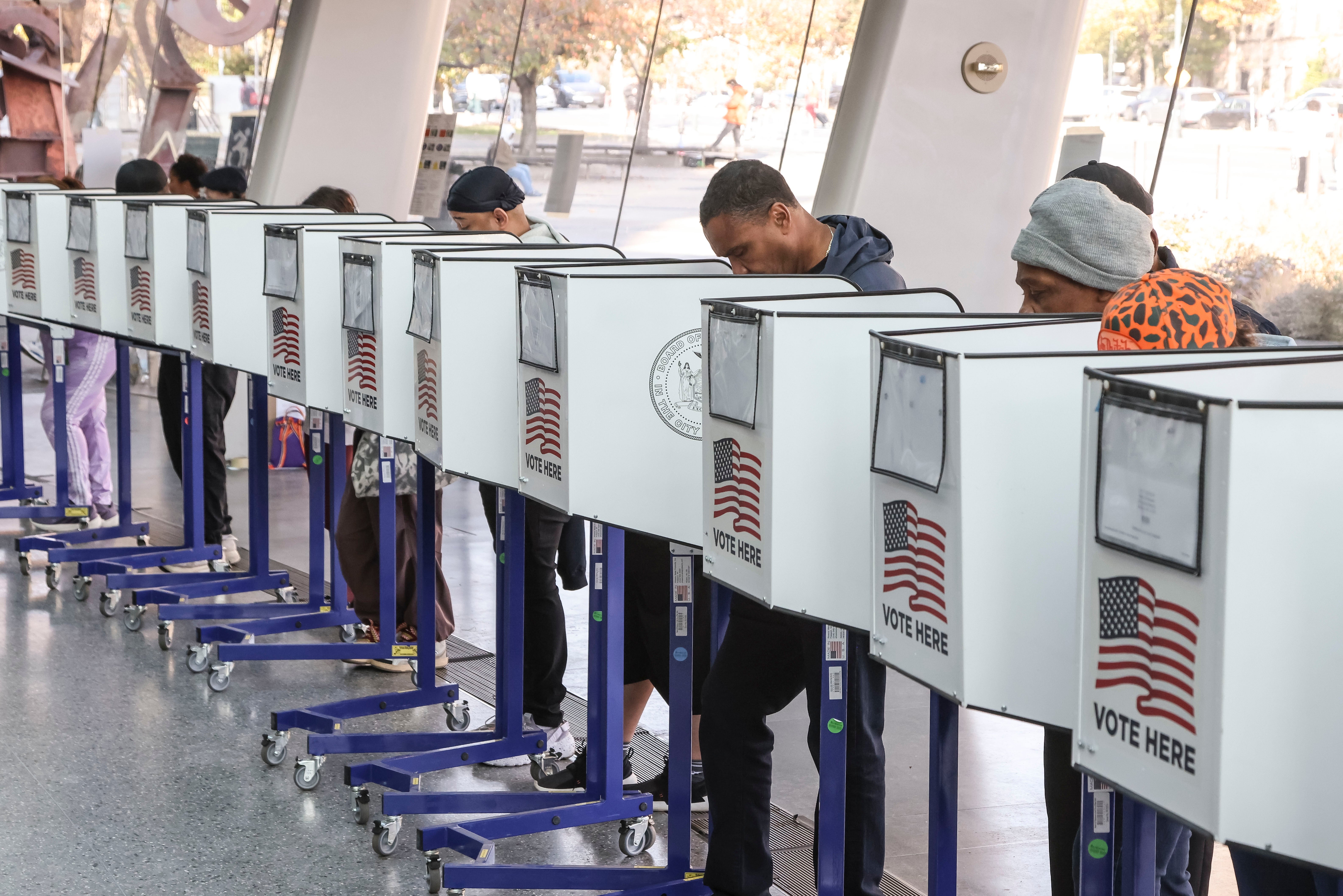 Voters cast their ballots at a polling site in the lobby of the Brooklyn Museum in New York City on November 5 2024