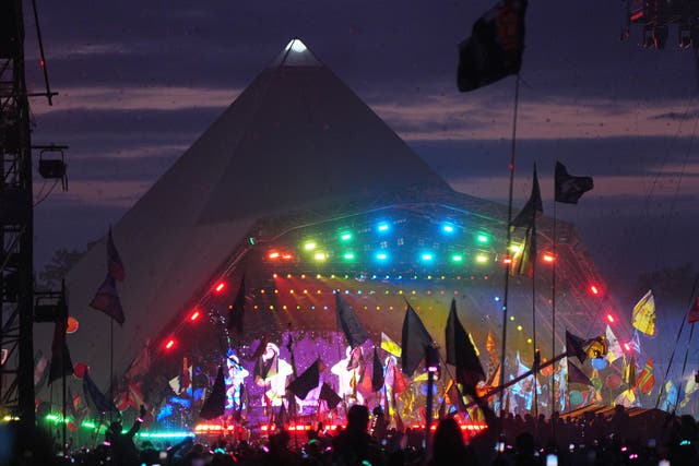 <p>The crowd watching Coldplay performing on the Pyramid Stage at the Glastonbury Festival (Yui Mok/PA)</p>