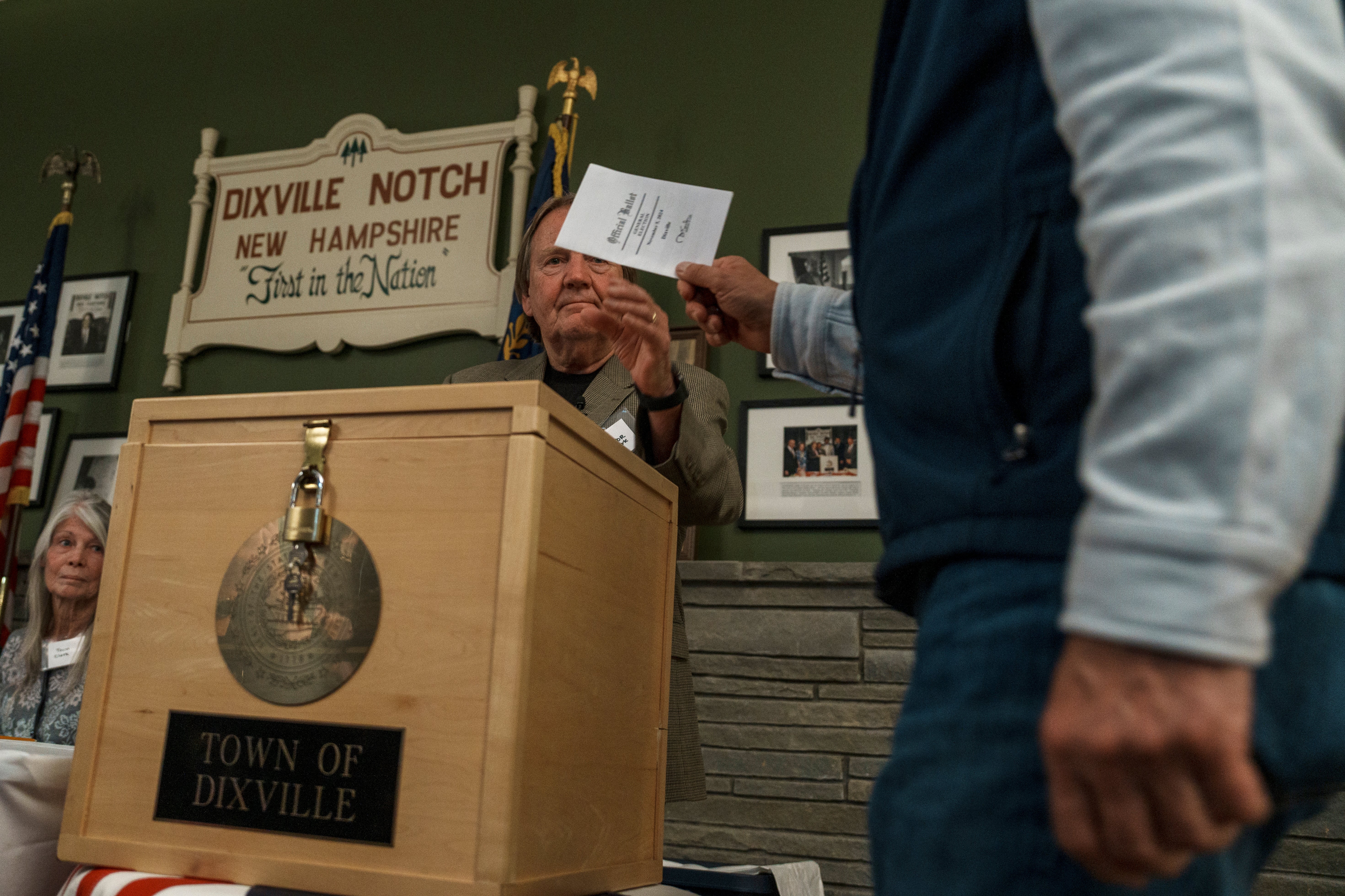 : Les Otten casts the first of six ballots after the polls opened in Dixville Notch