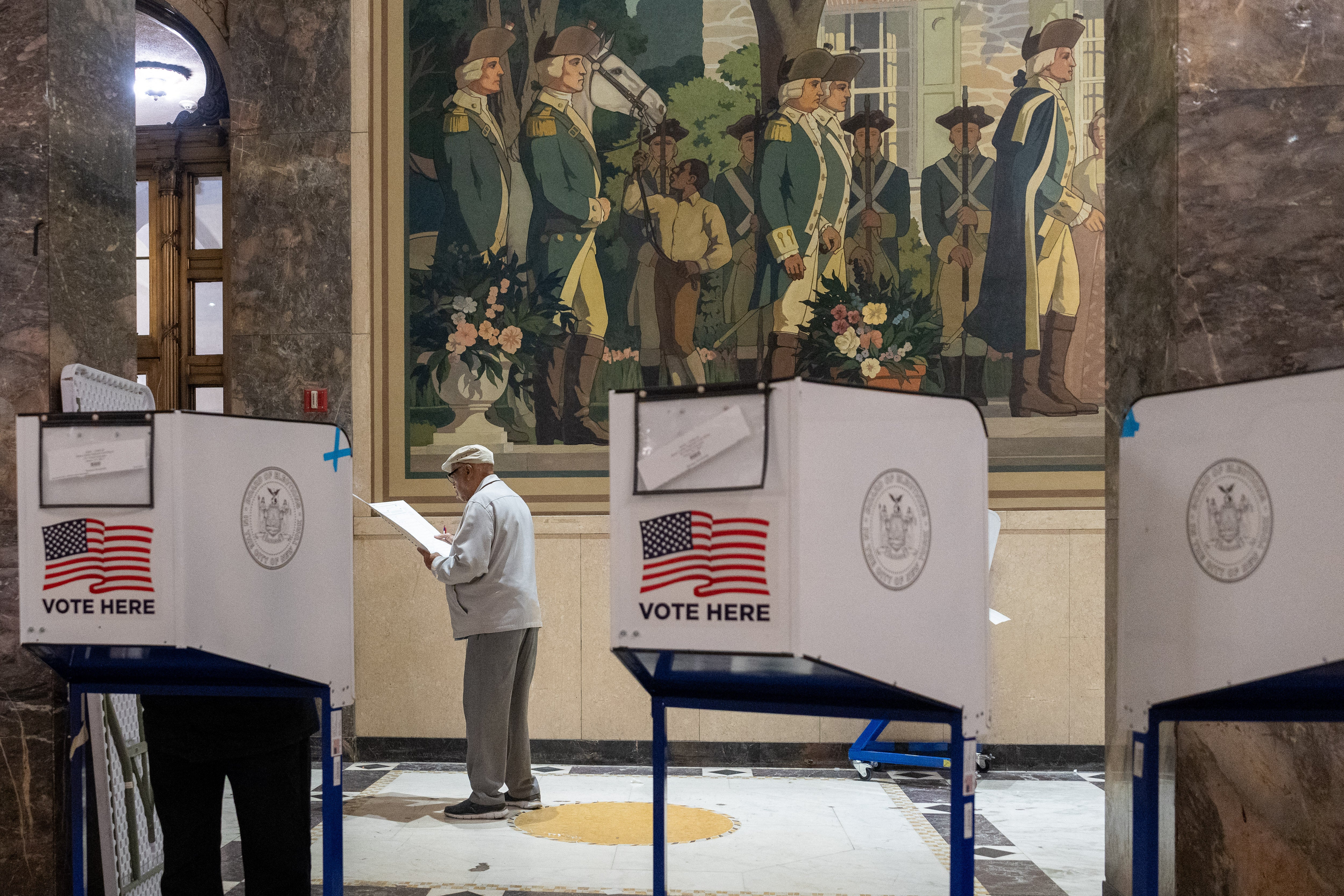 People vote at a polling station in the Bronx borough of New York City on November 5