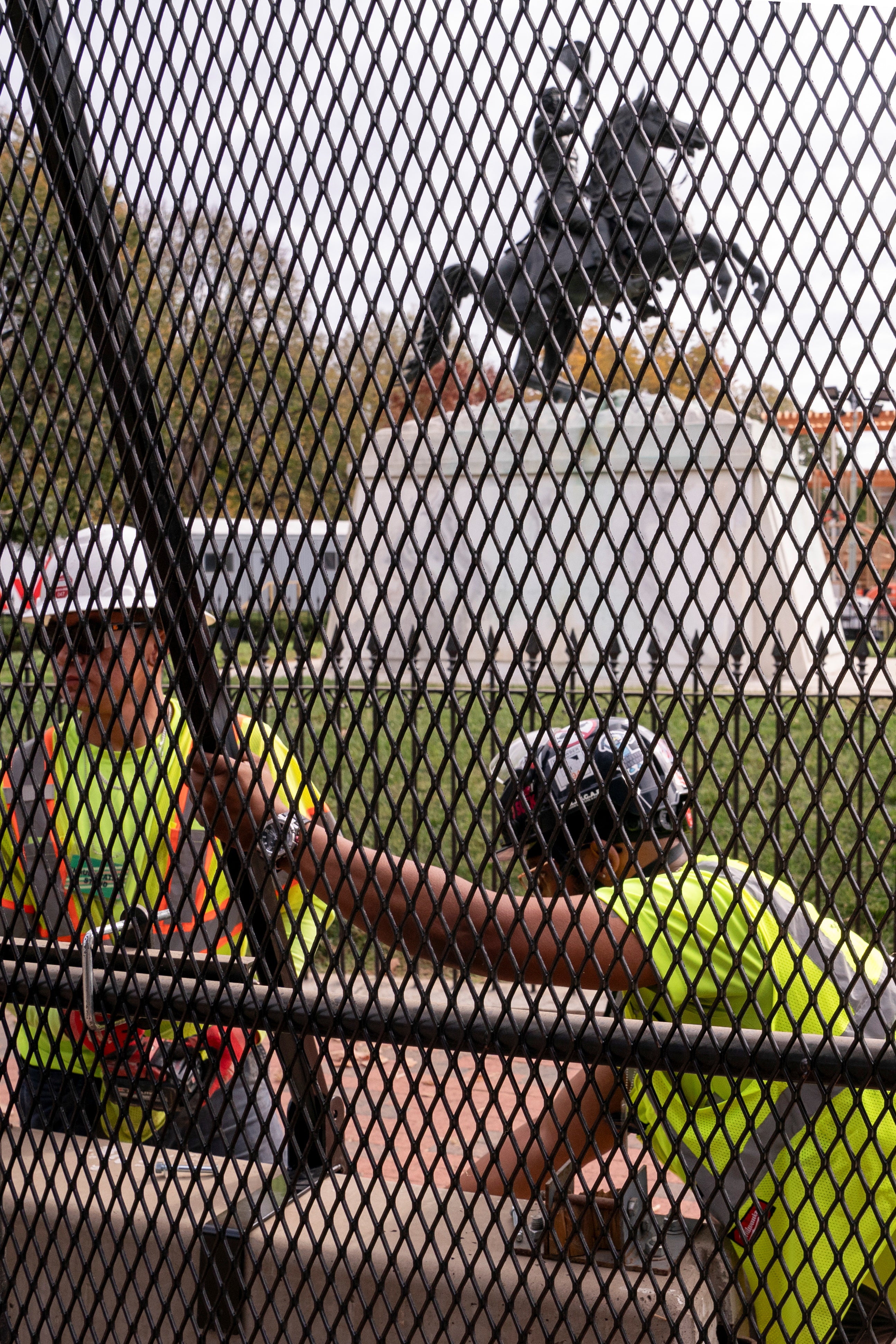 Workers erecting security fencing near the White House on Monday