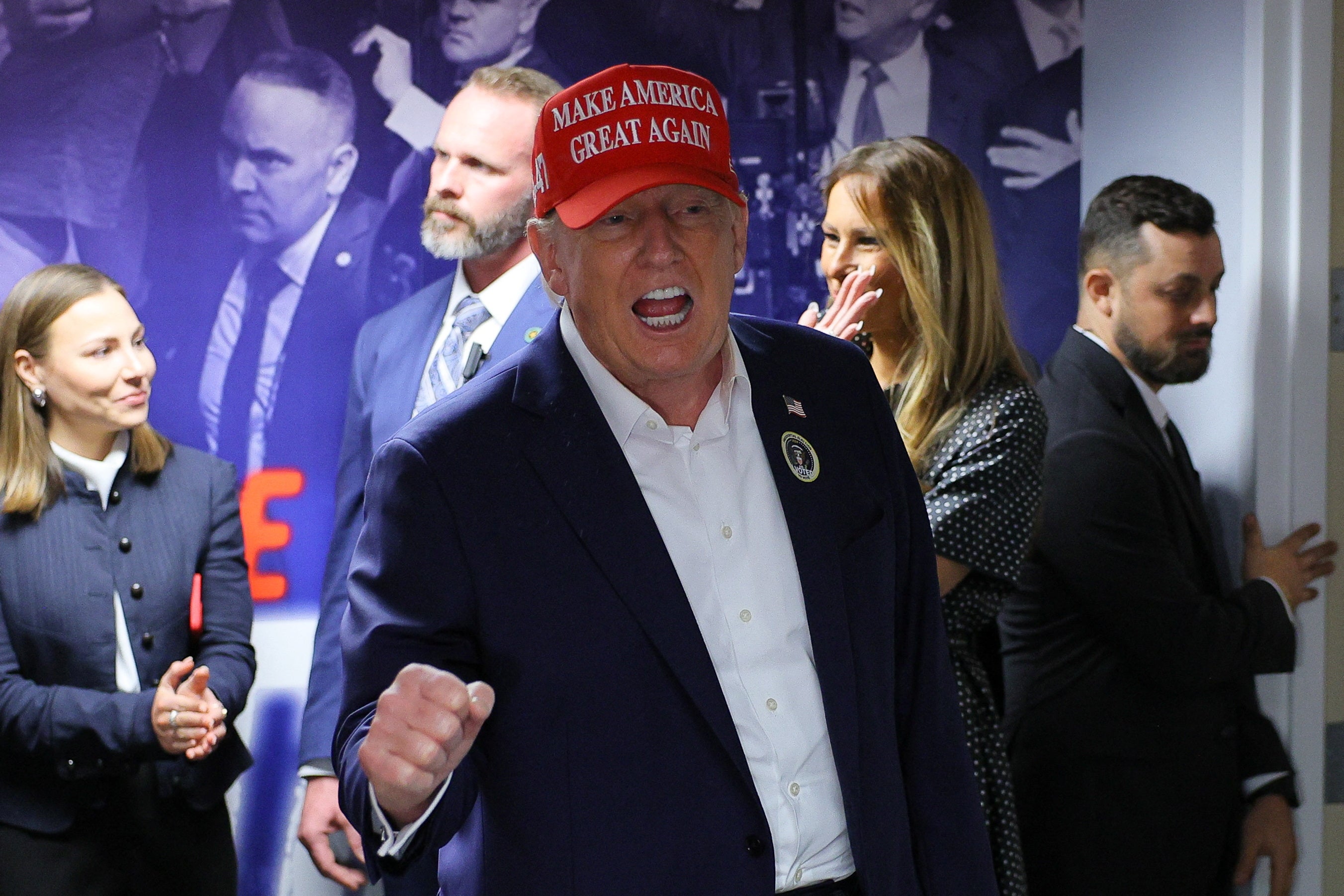 Republican presidential nominee and former U.S. President Donald Trump, accompanied by former U.S. first lady Melania Trump, visits his campaign headquarters to thank the campaign workers on Election Day, in West Palm Beach, Florida, U.S., November 5, 2024