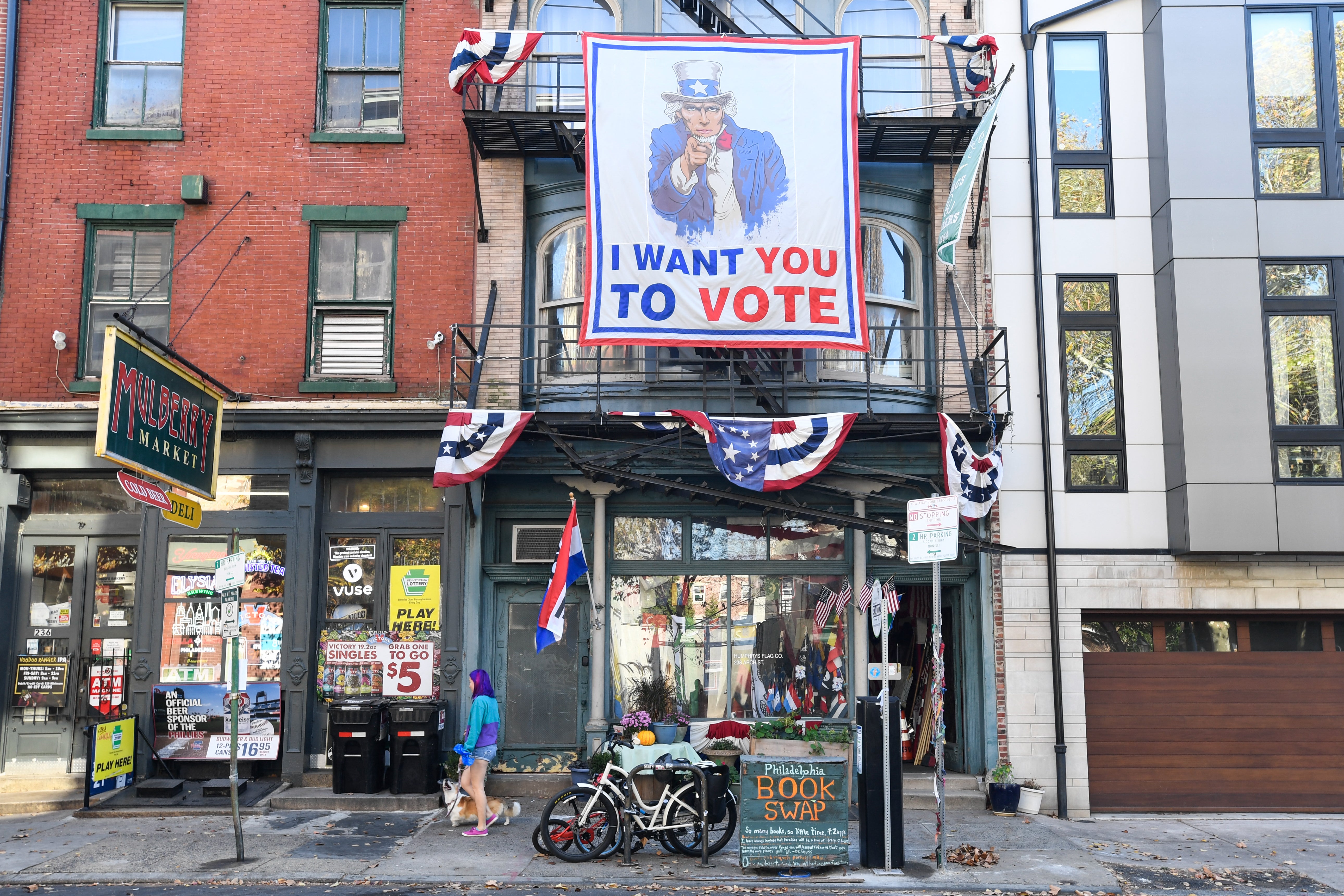 A sign encouraging people to vote hangs from the facade of a building in downtown Philadelphia, Pennsylvania, on Election Day