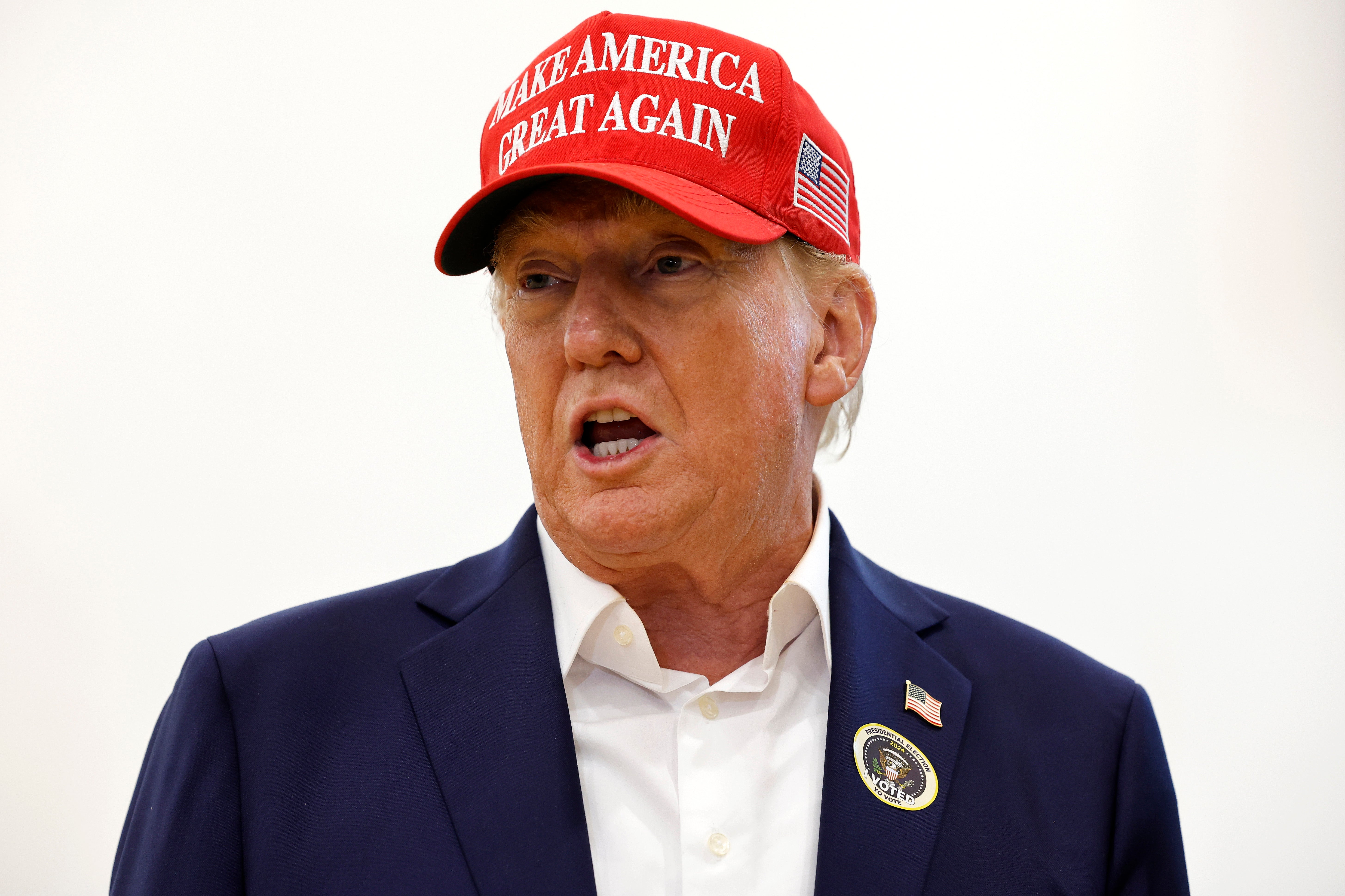 Trump speaks to reporters after casting his vote in Palm Beach