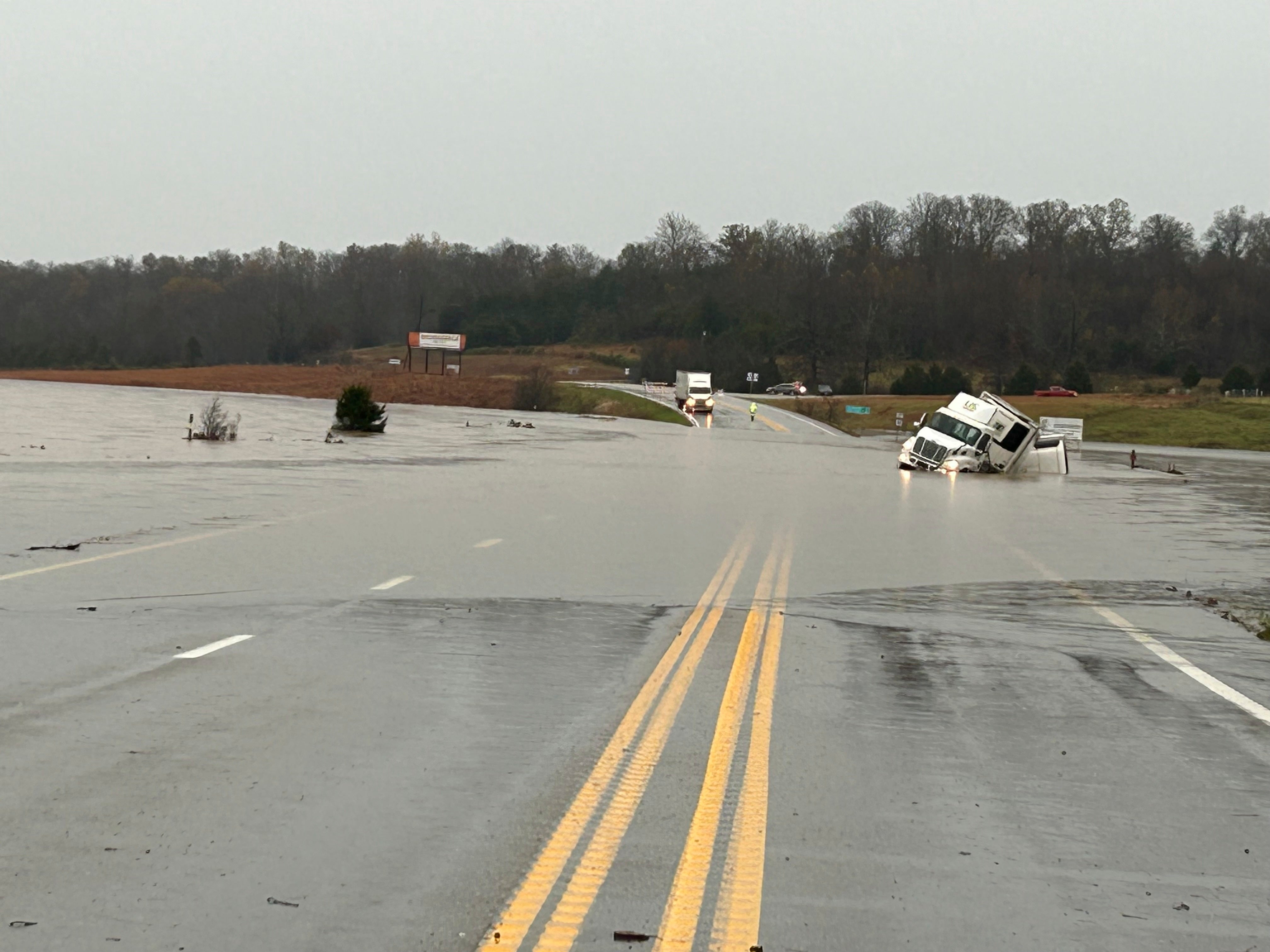 In a photo released by the Missouri State Highway Patrol, a tractor trailer sits submerged in flood water