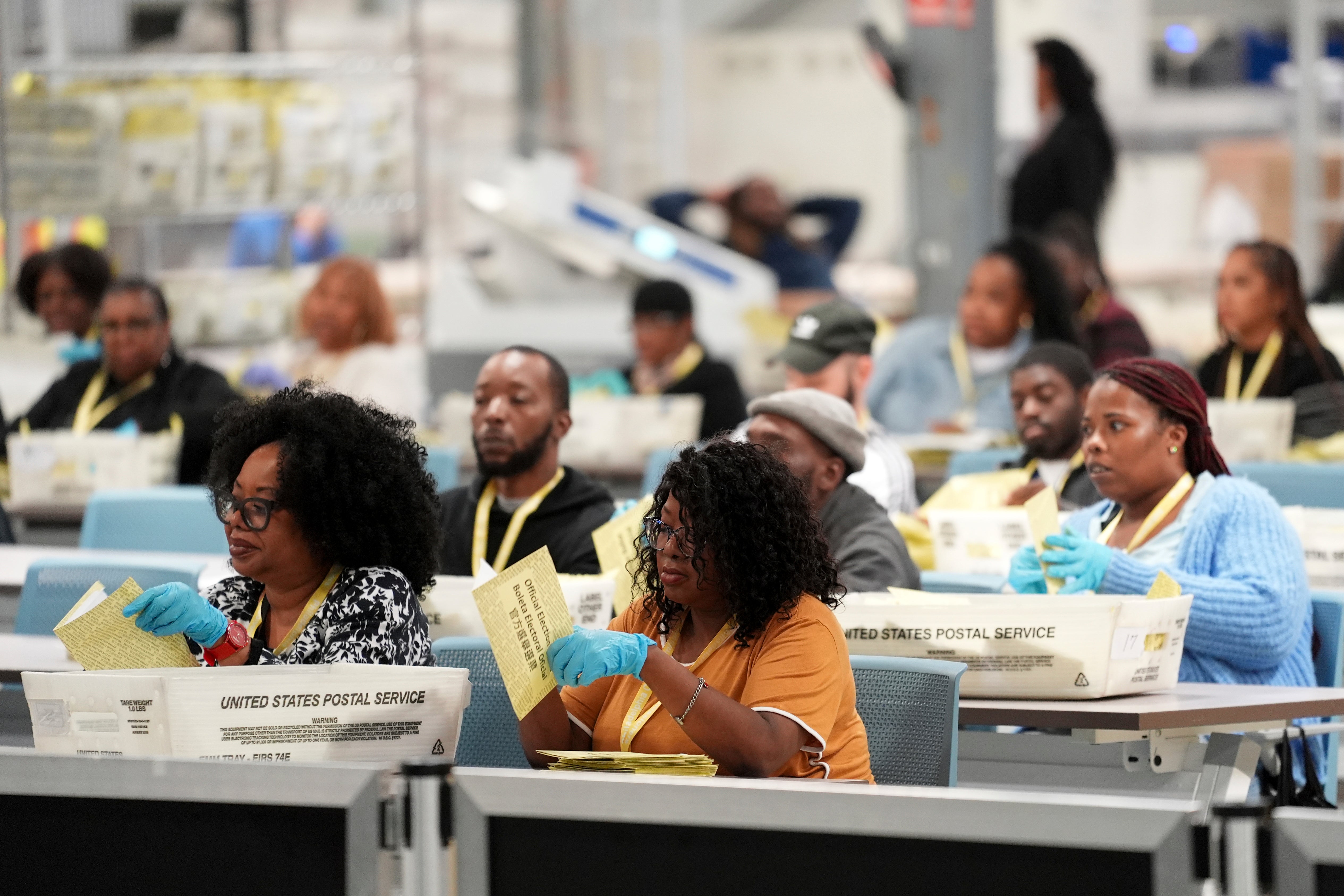 Workers process mail-in ballots for the 2024 General Election at the Philadelphia Election Warehouse on Tuesday