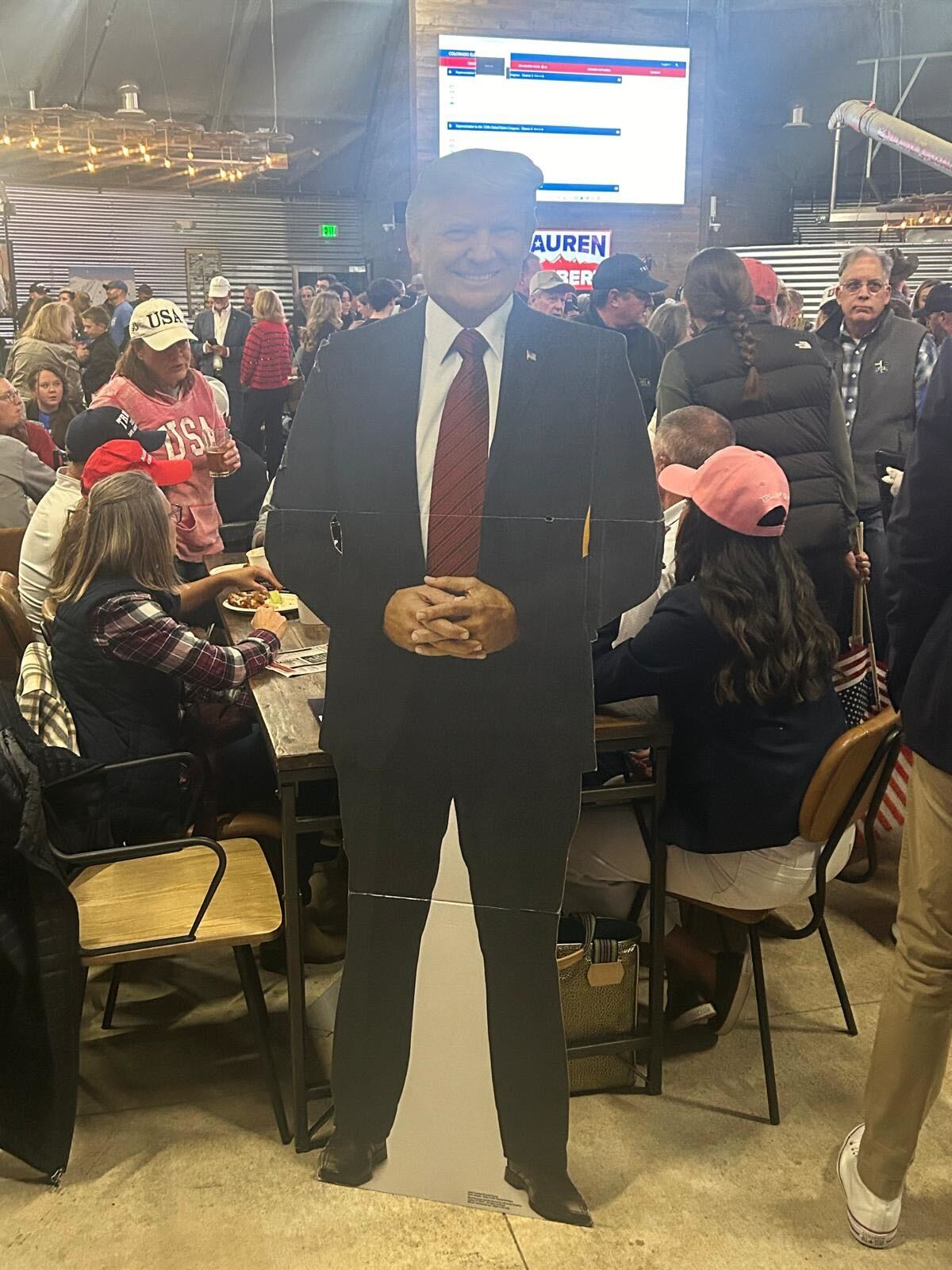 A Donald Trump cut out at the Boebert watch party