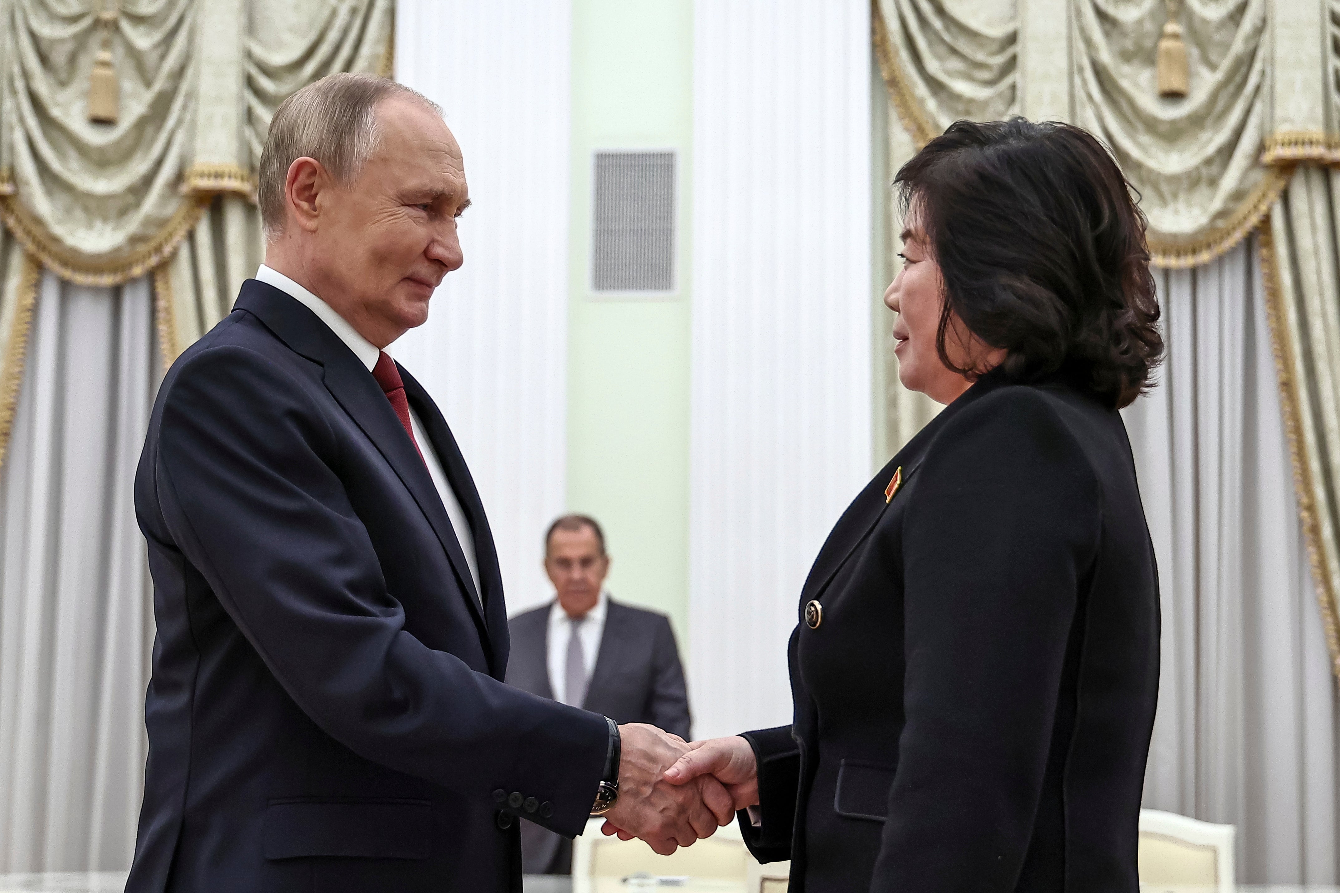 Russian President Vladimir Putin greets North Korean Foreign Minister Choe Son Hui during their meeting at the Kremlin in Moscow