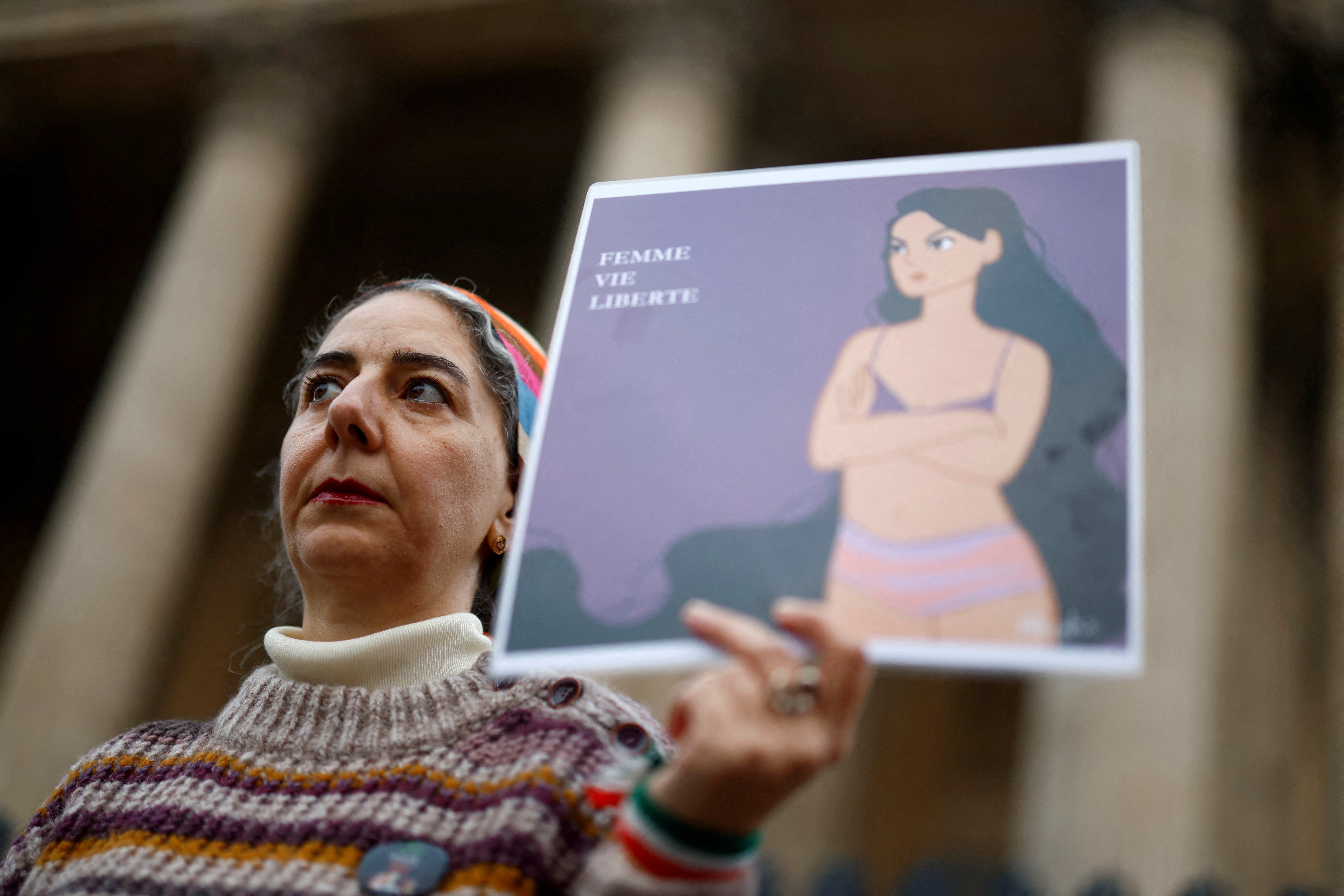 Rally in Paris in support of an Iranian woman who stripped off clothes at an Iranian university