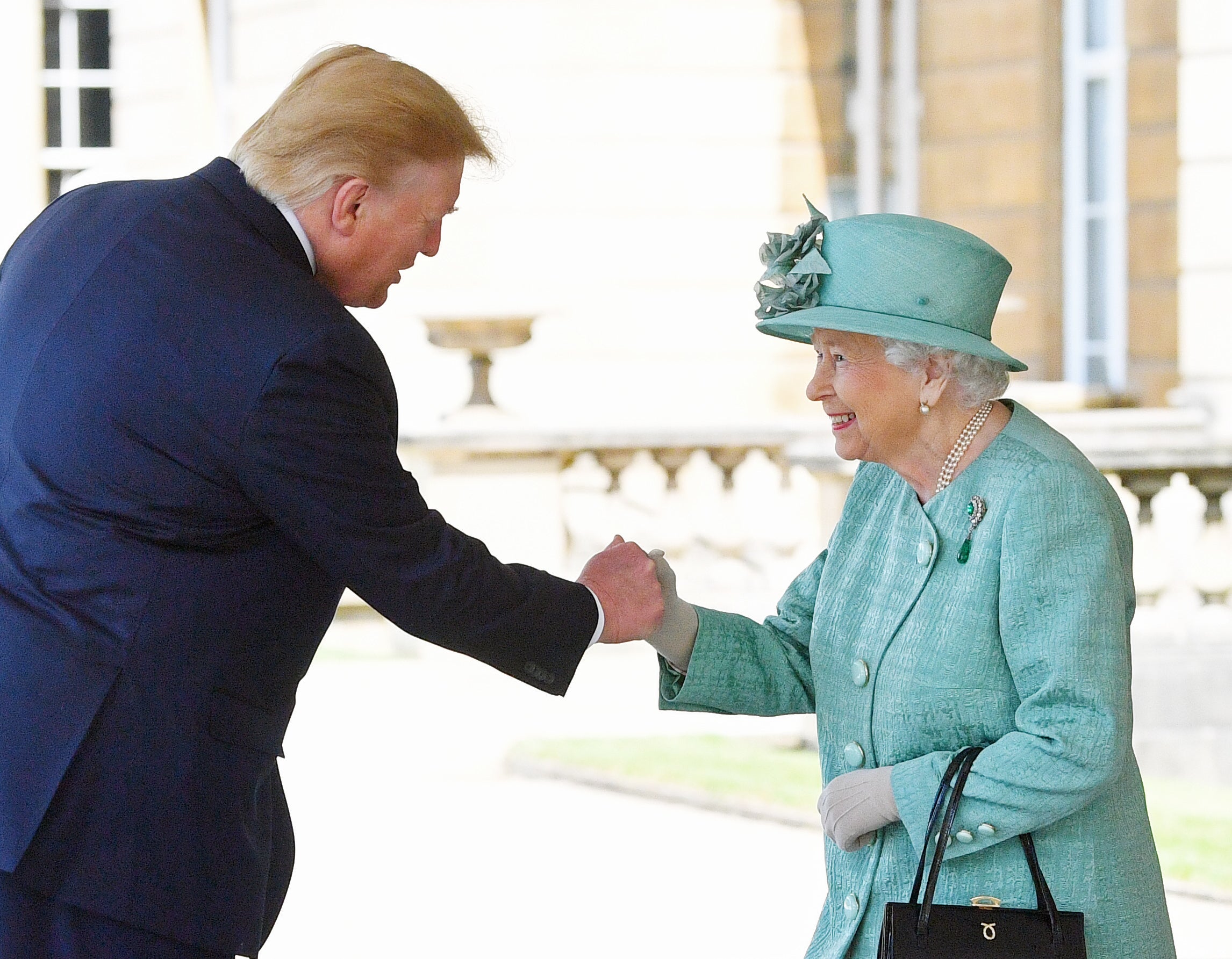 Elizabeth II got an unusual handshake when she greeted then-US President Donald Trump in 2019 (Victoria Jones/PA)