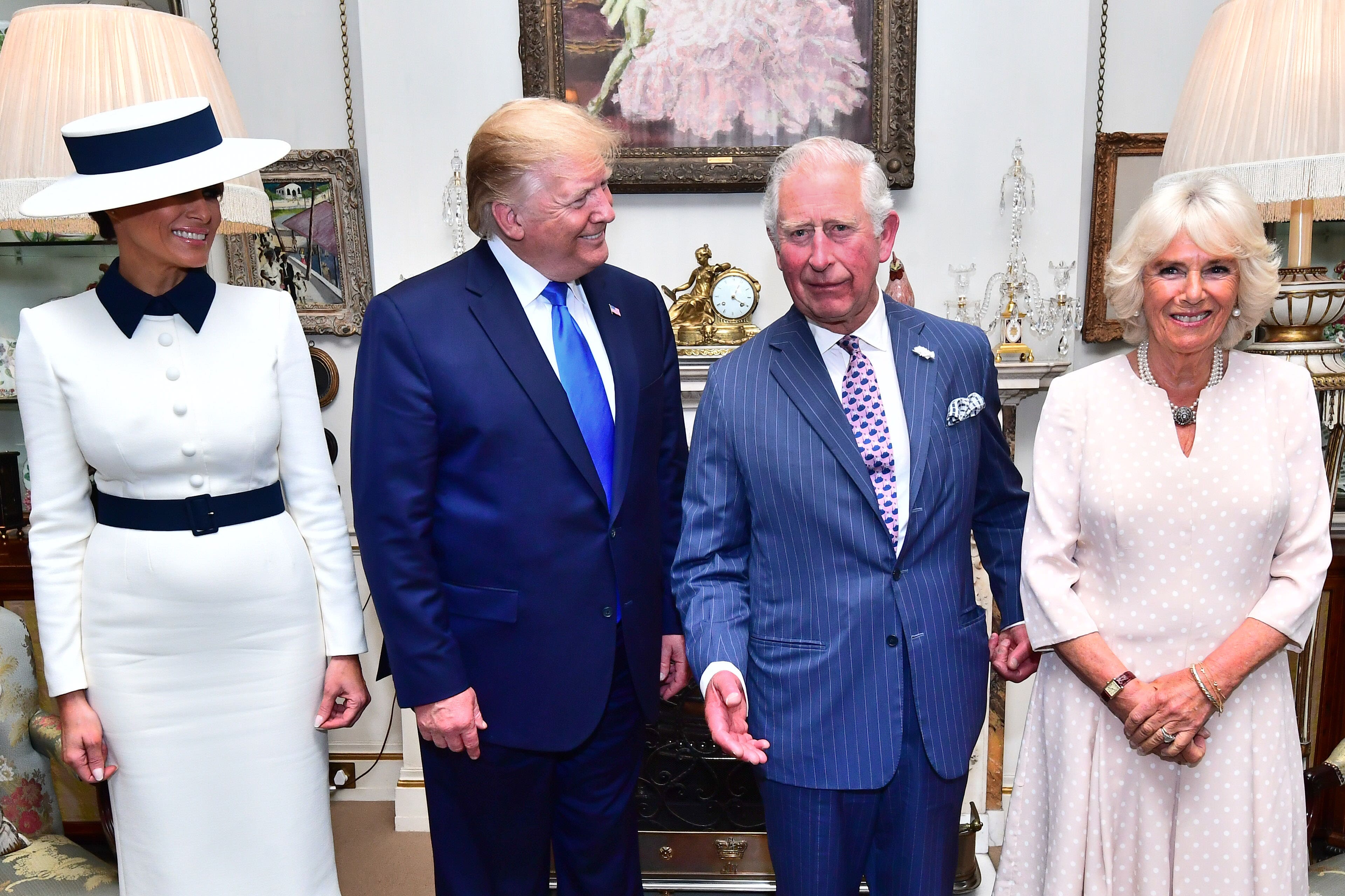 Then-US President Donald Trump and his wife Melania at Clarence House to take tea with the then-Prince of Wales and Duchess of Cornwall during his 2019 state visit (Victoria Jones/PA)