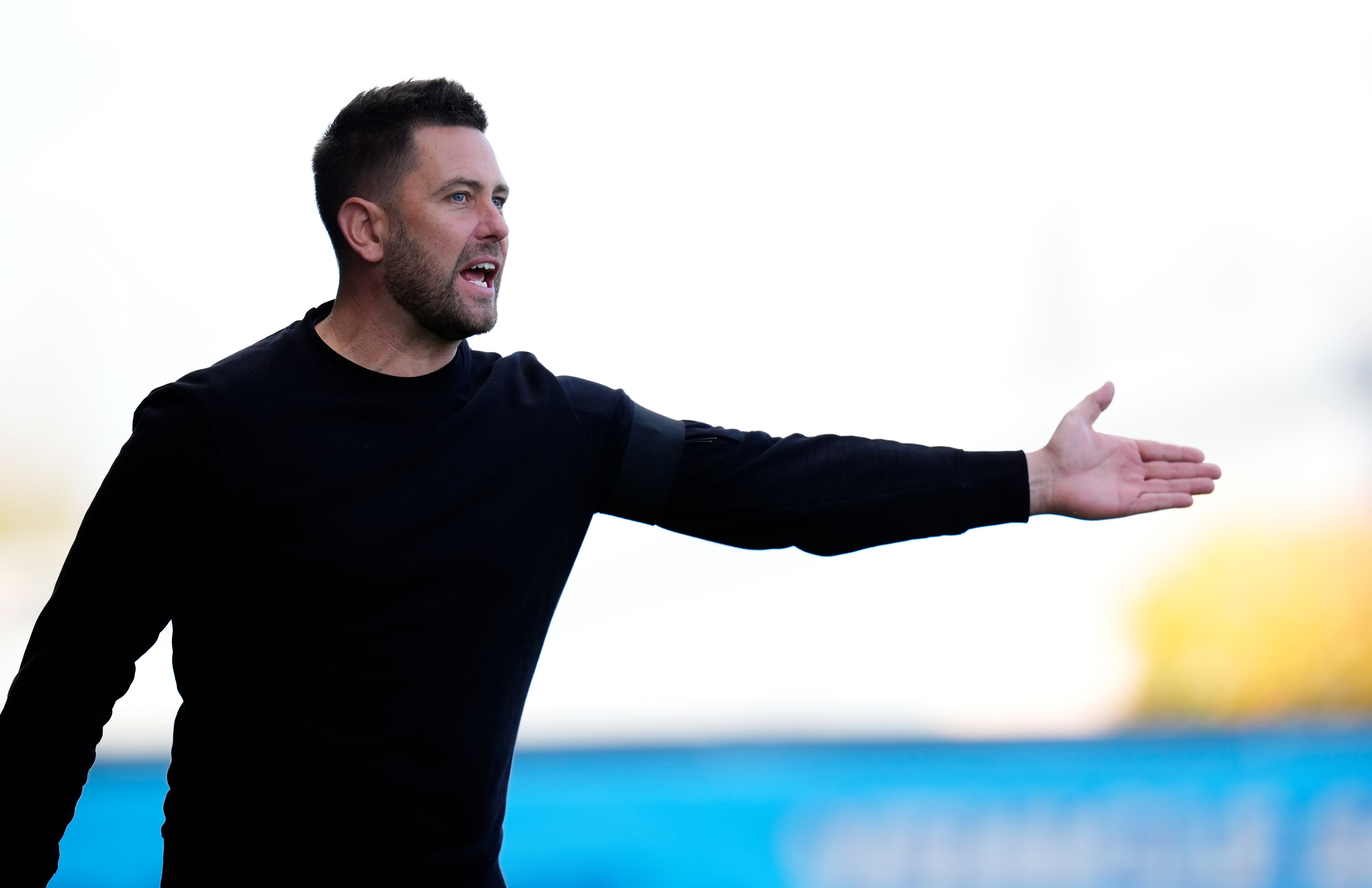 Buckingham gives instructions from the touchline at the Kassam Stadium