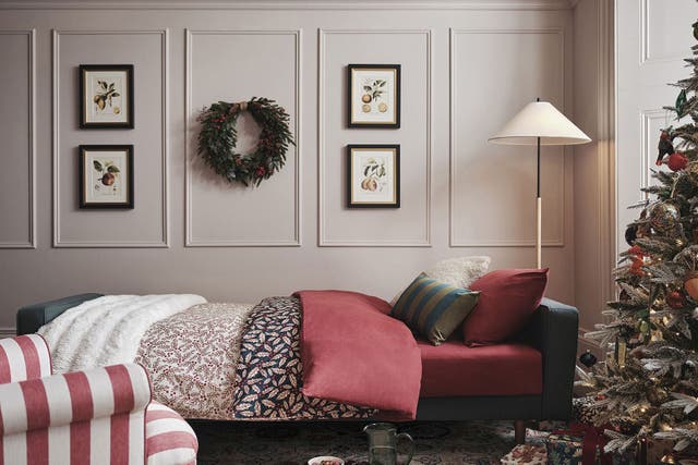 A Christmas wreath is one of the most heartening ways to say welcome (John Lewis/PA)