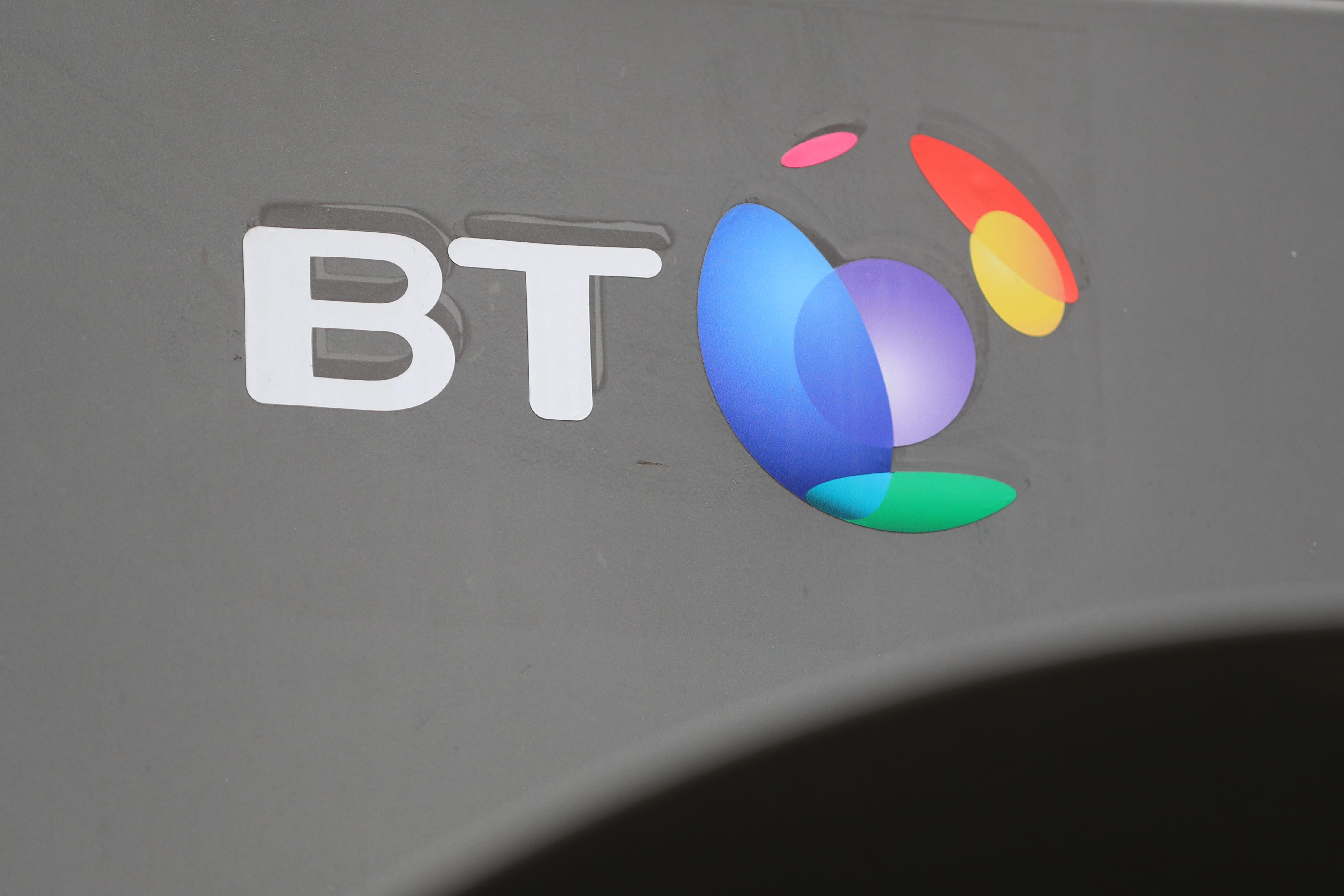 Telecoms giant BT has cut its annual sales outlook and revealed another 2,000 jobs have gone under its ongoing plan to slash costs (PA)