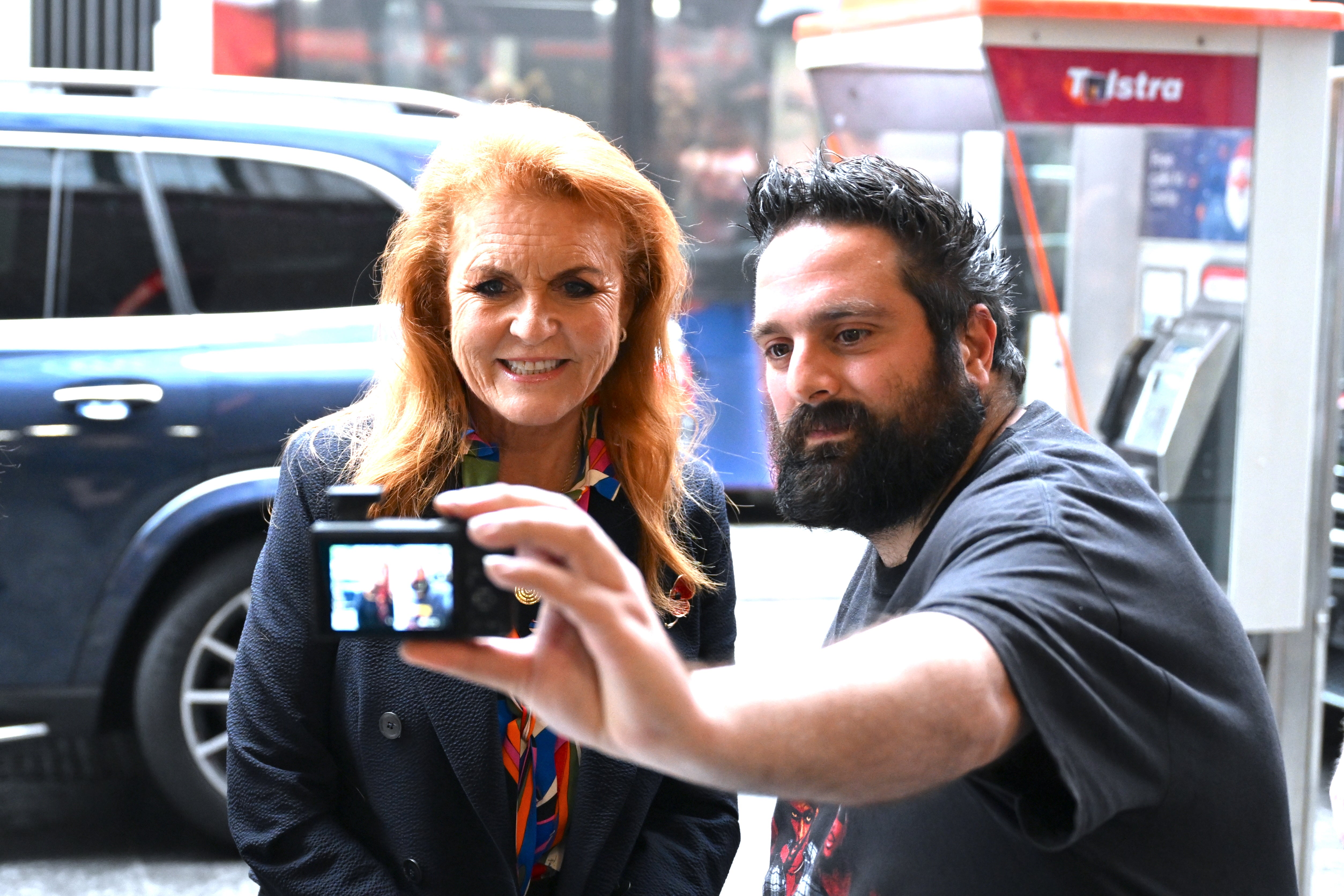 Sarah Ferguson, Duchess of York poses for a photograph with a supporter during a book signing event at Dymocks bookstore in Sydney, Australia