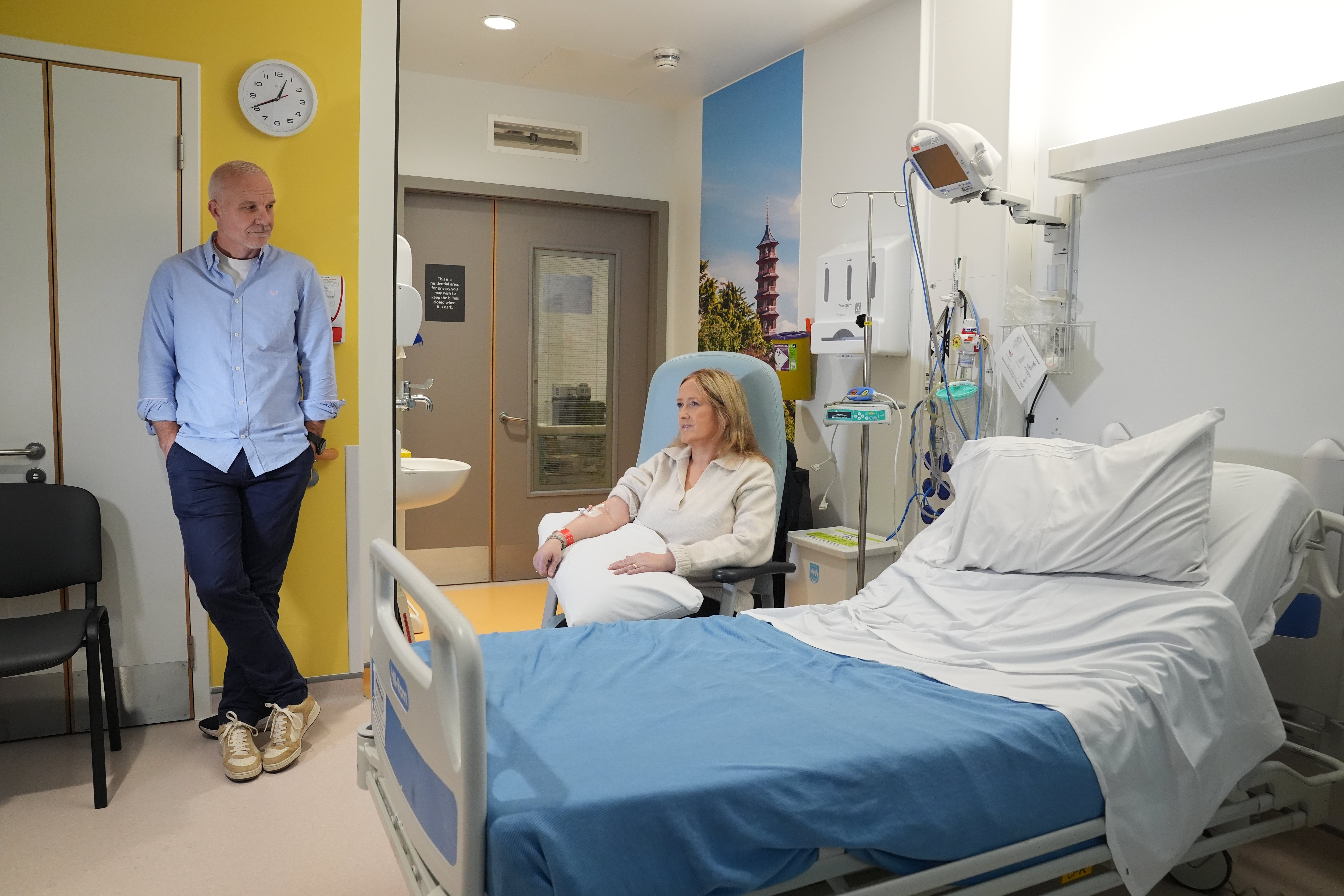 Patient Katie Tinkler talks with her husband Simon before she receives a breakthrough treatment for lupus