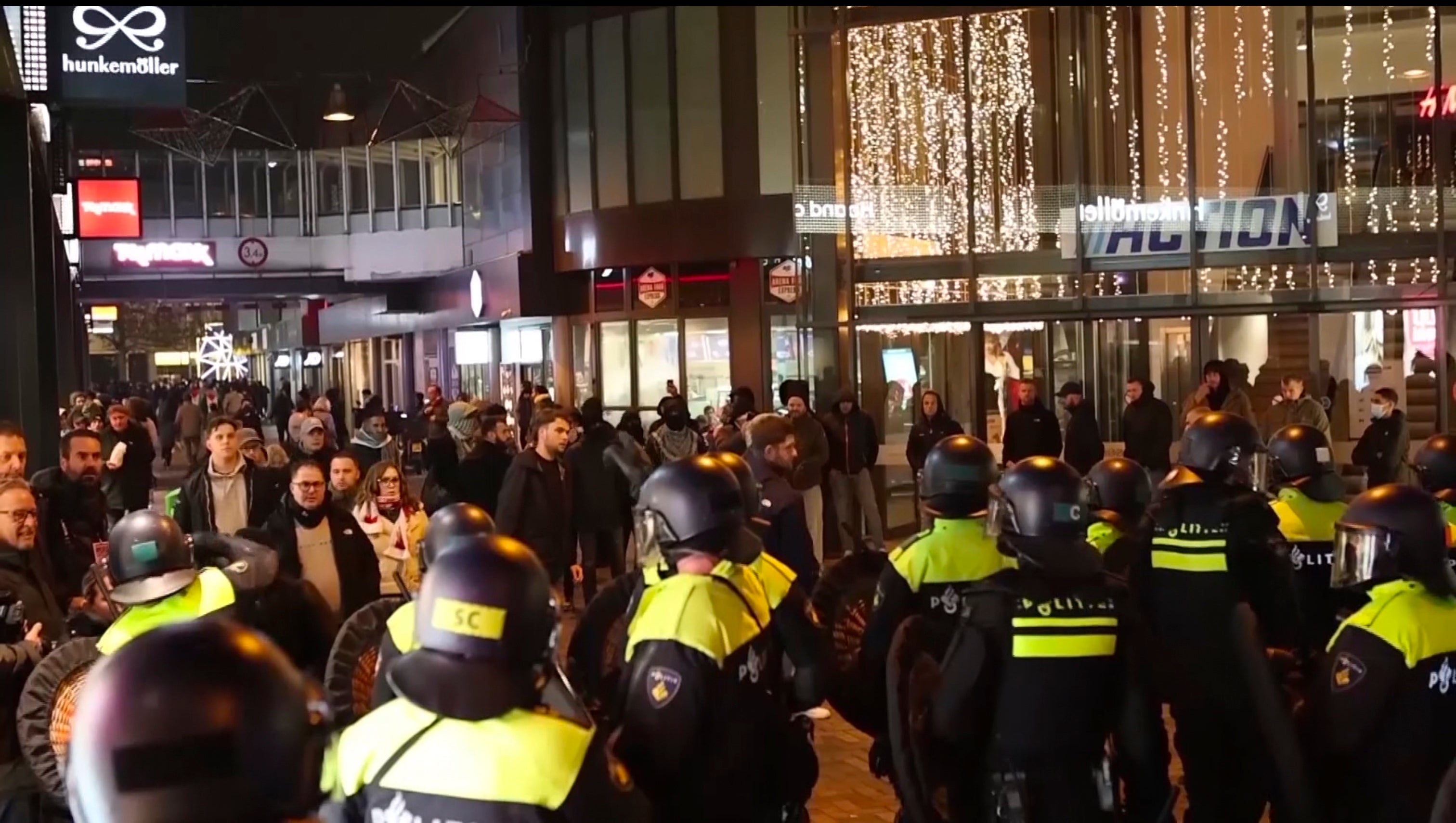 In this image taken from video, police stand guard forming a line near the Ajax stadium, in Amsterdam