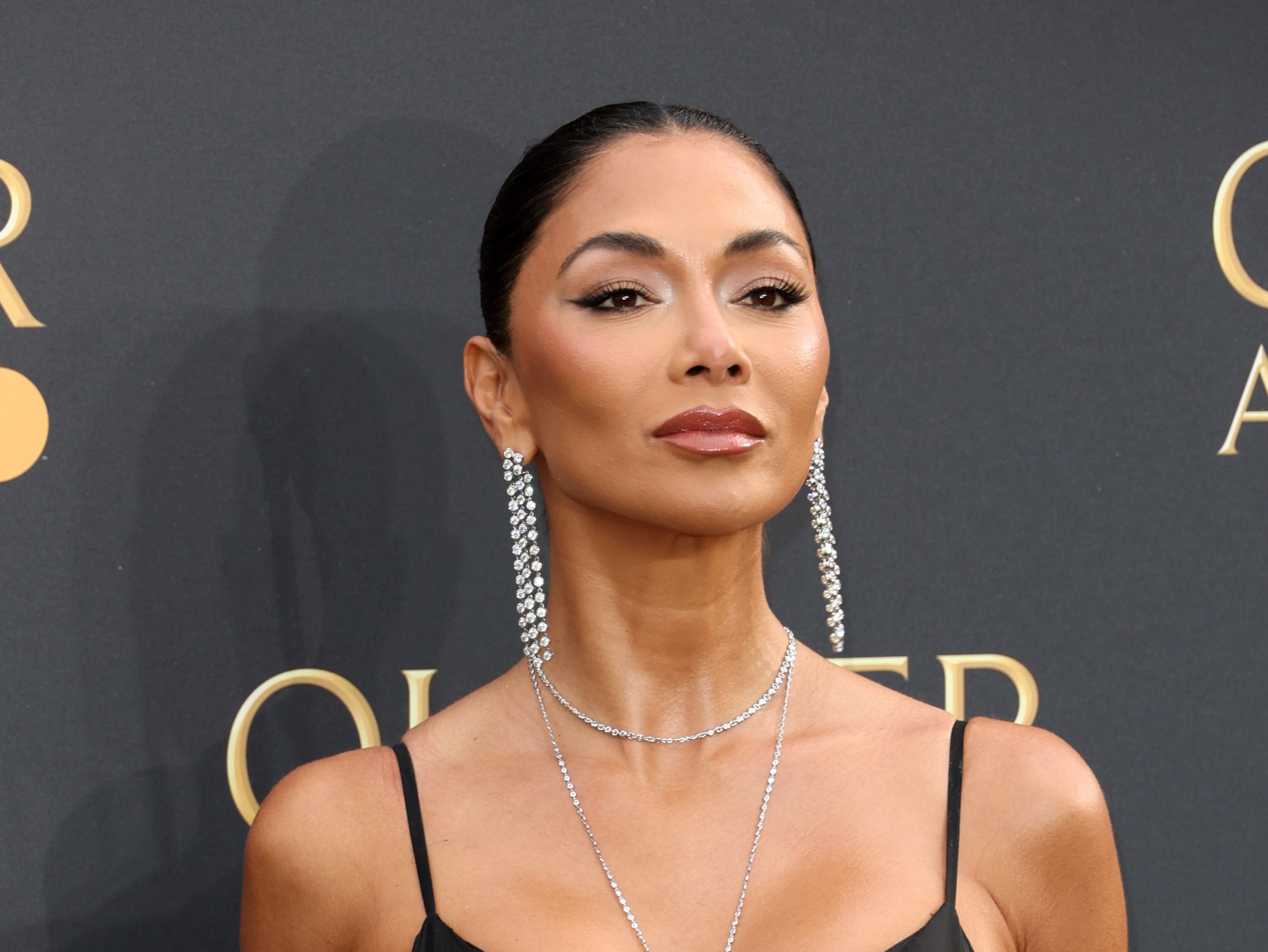 Nicole Scherzinger apologizes over comment she left on Russell Brand’s Instagram, which fans thought signified she supported Donald Trump