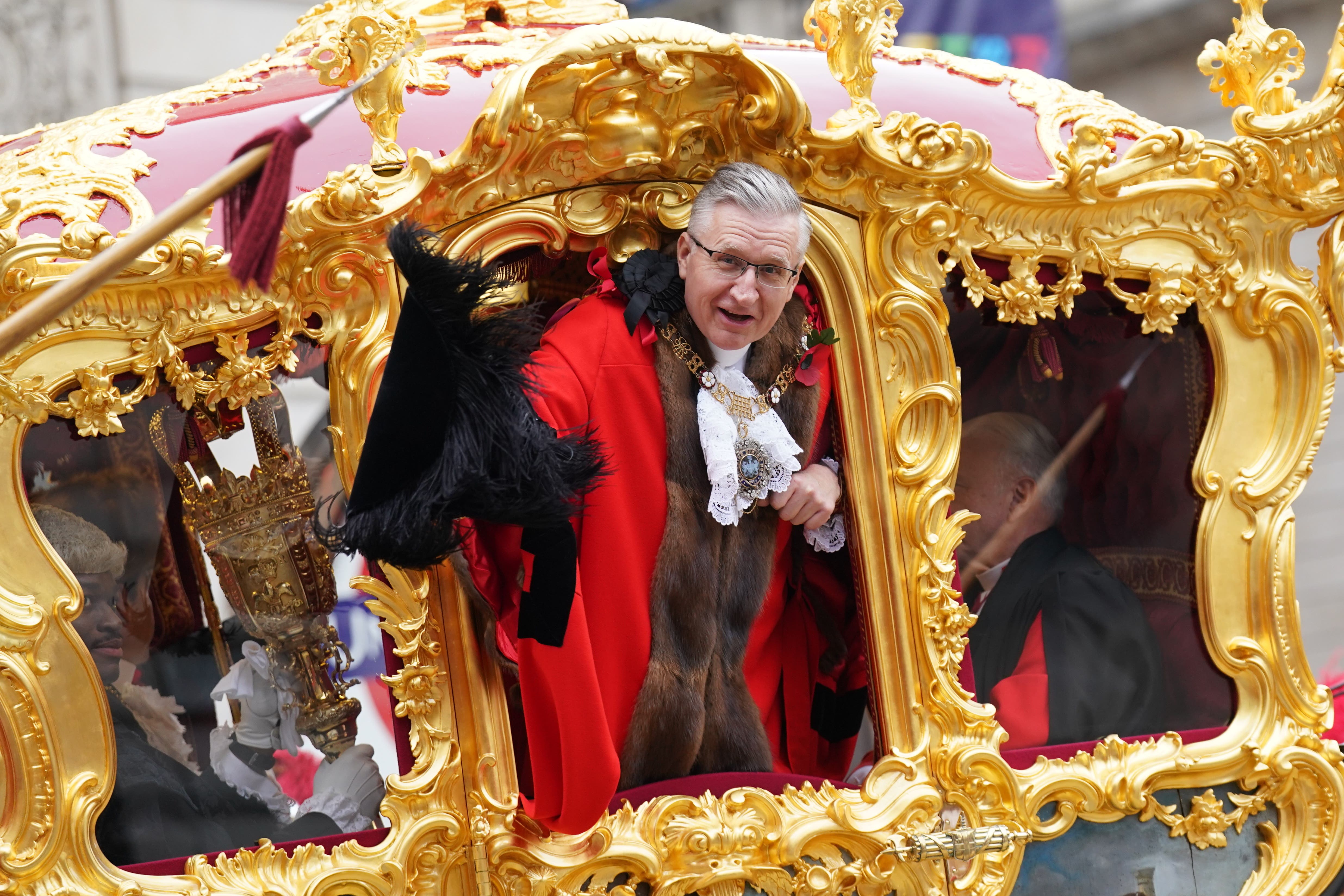 Alastair King, the 696th Lord Mayor of the City of London, waves from the state coach (Stefan Rousseau/PA)