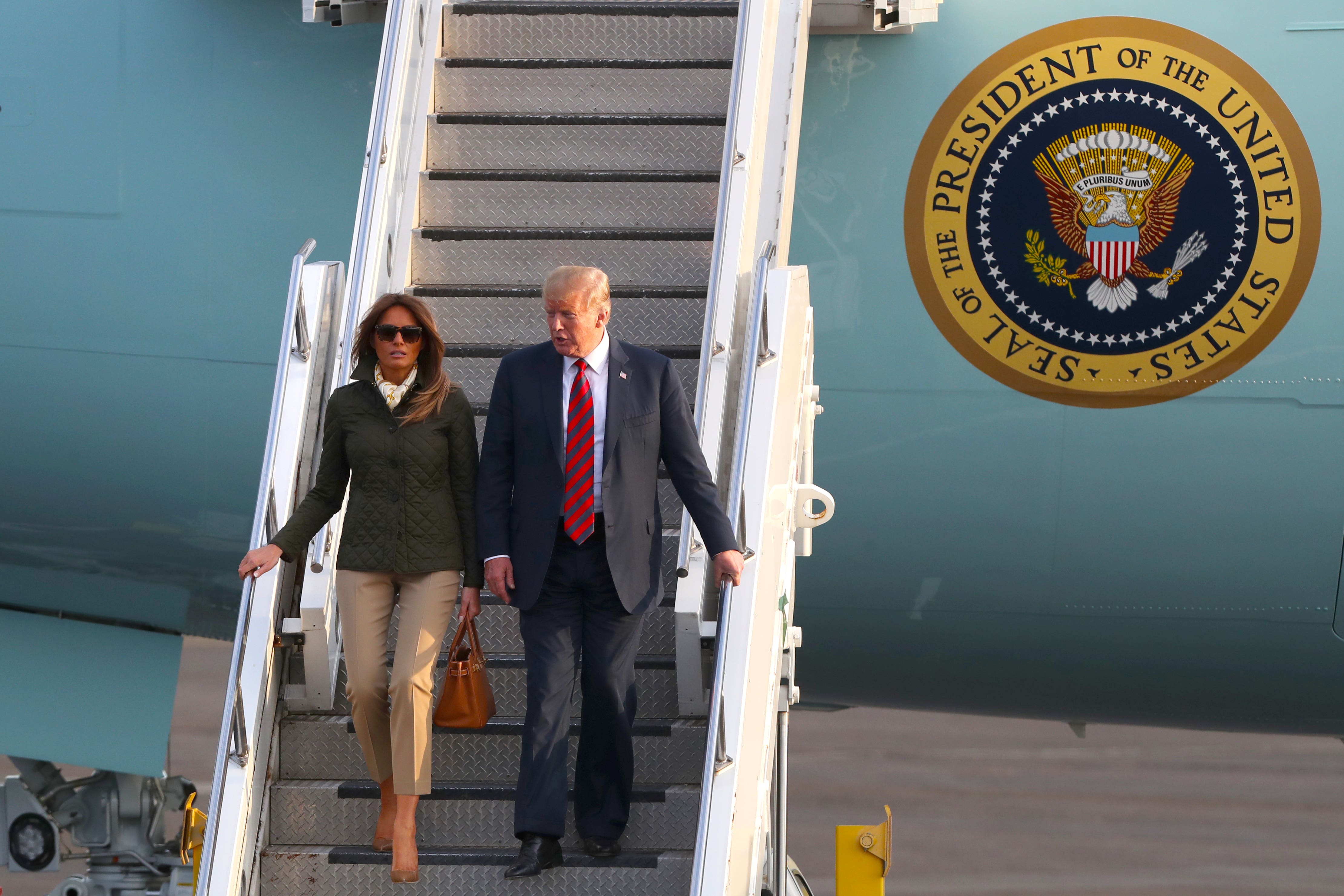 Donald Trump and his wife, Melania, arrive on Air Force One at Prestwick airport in Ayrshire during his first spell in office (Andrew Milligan/PA)