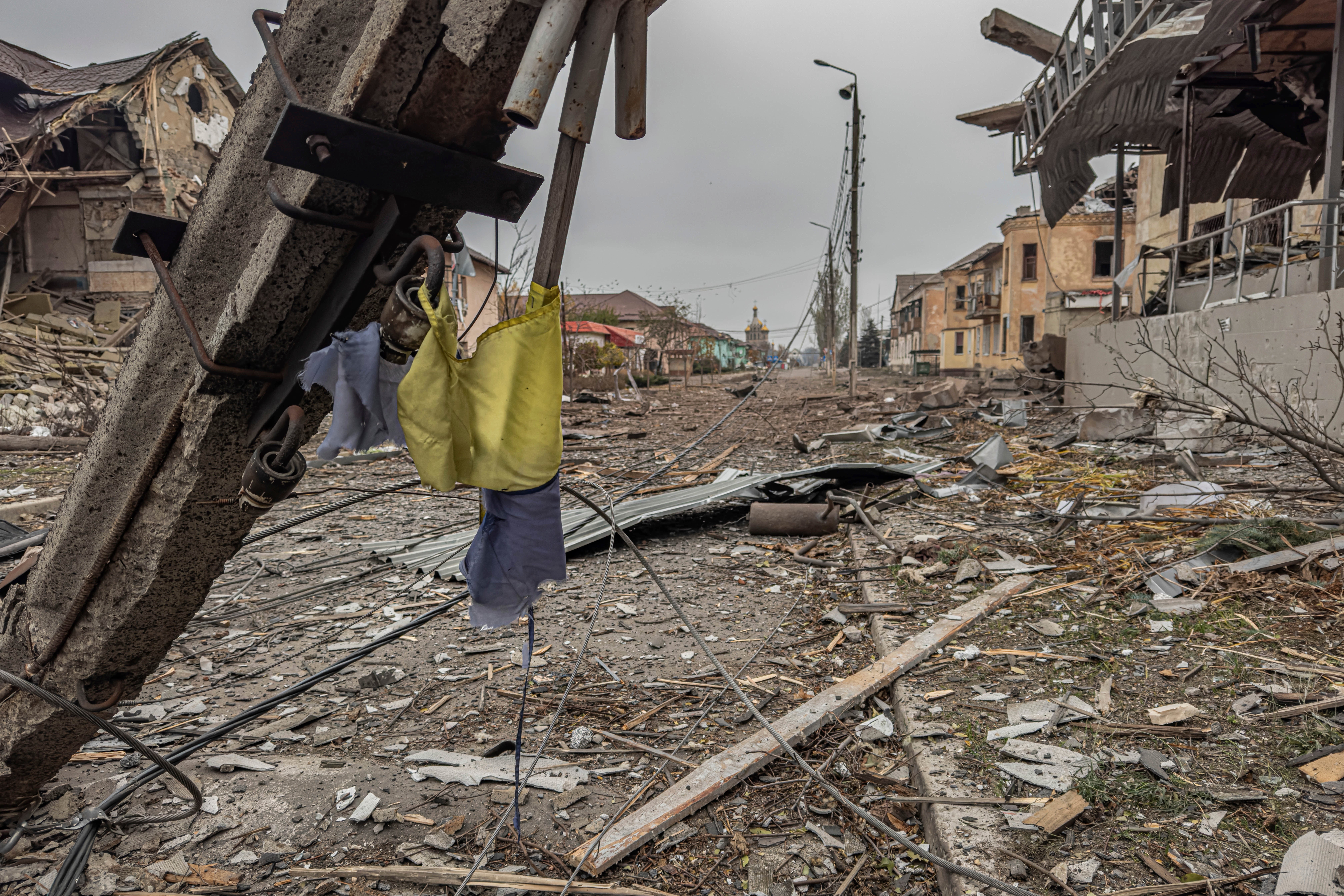 A central streets covered in debris from destroyed residential buildings after Russian bombing in Kurakhove, Donetsk