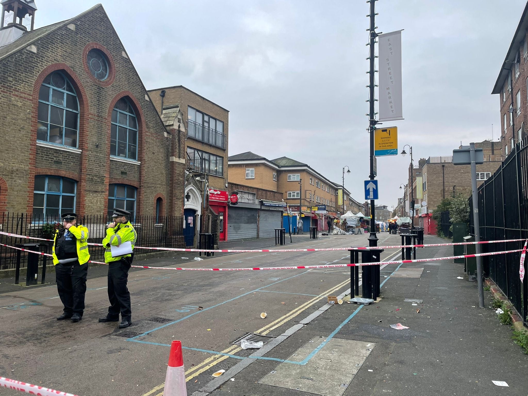 Traders appeared to have abandoned their stalls at the popular market as detectives investigate the triple stabbing