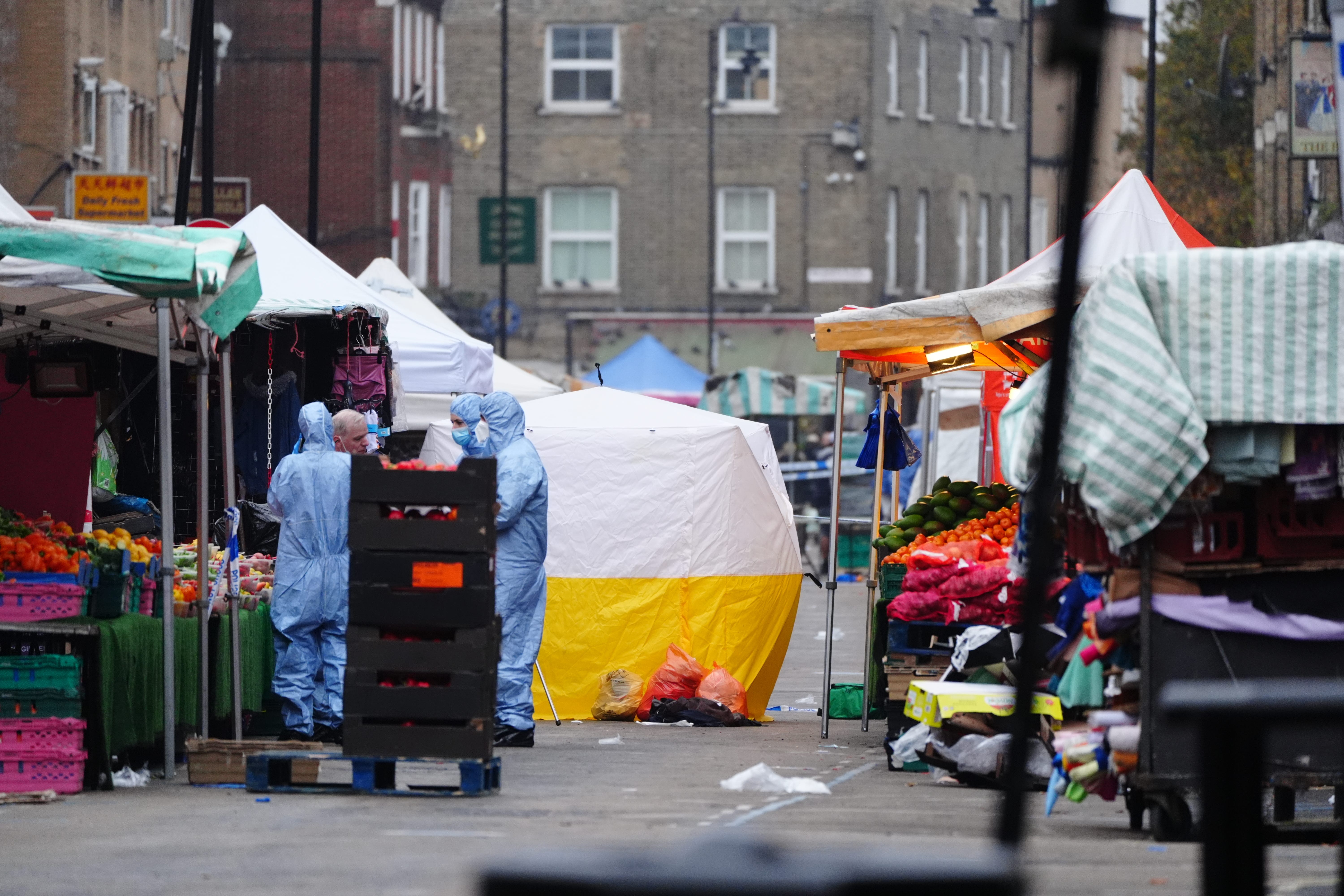 Forensic officers at the scene in East Street, Walworth, south London, following a fatal stabbing (Aaron Chown/PA)