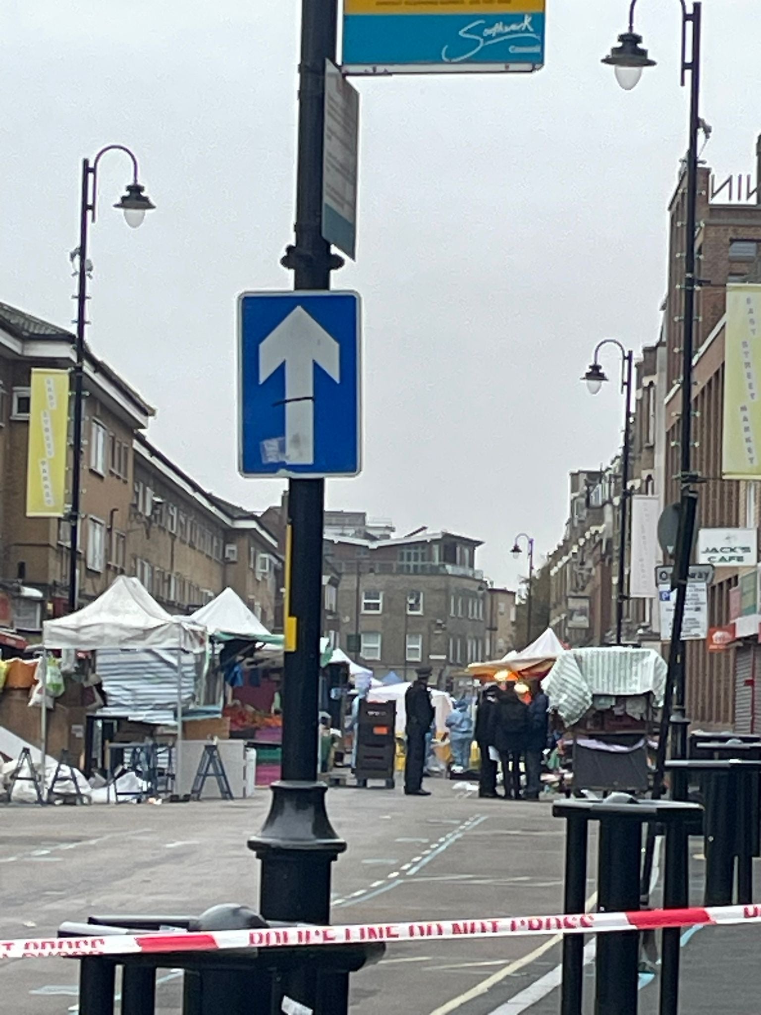 Police forensics at the scene of the knife attack in East Street, south London