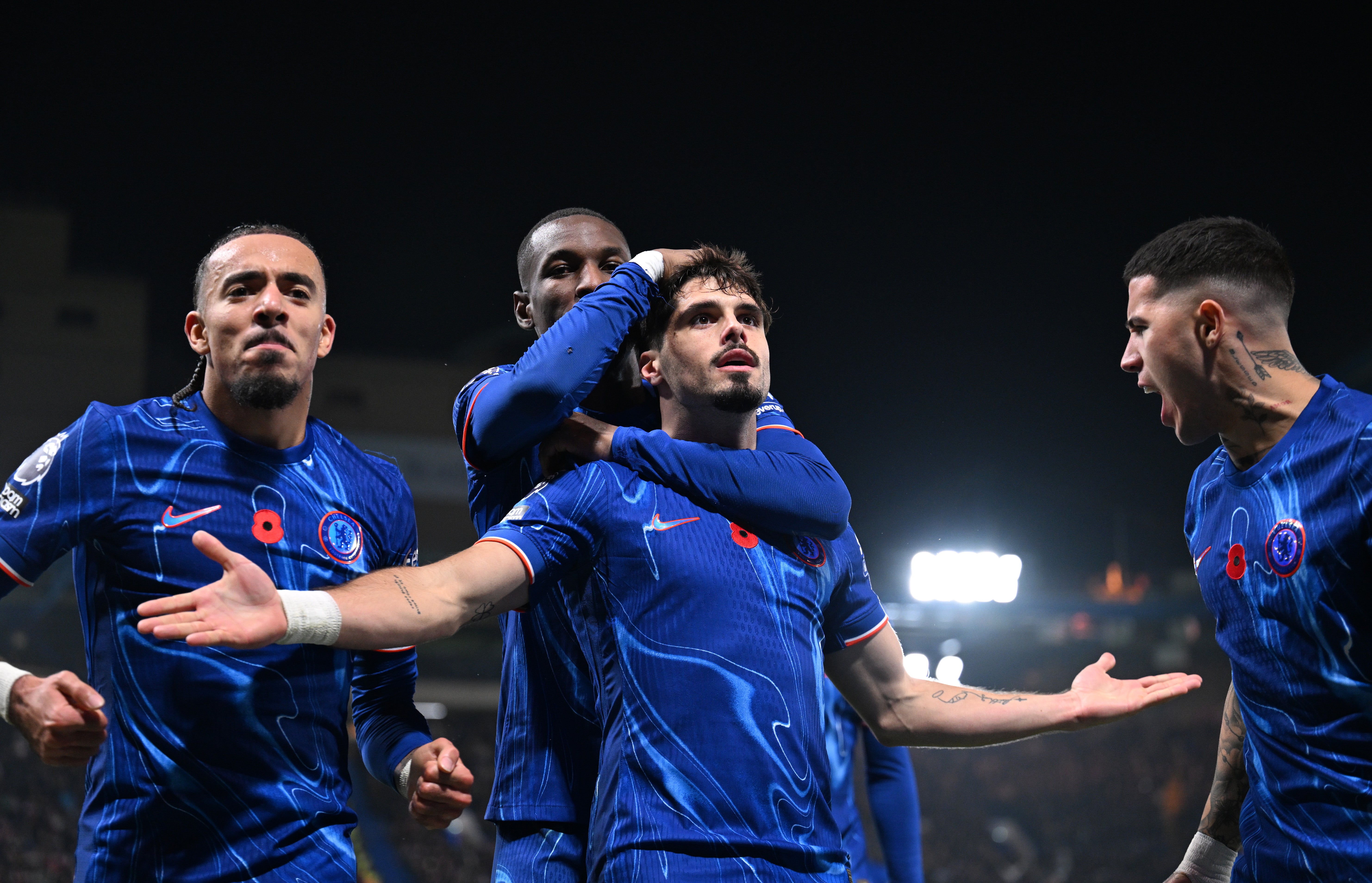 The winger celebrates in front of the Chelsea fans