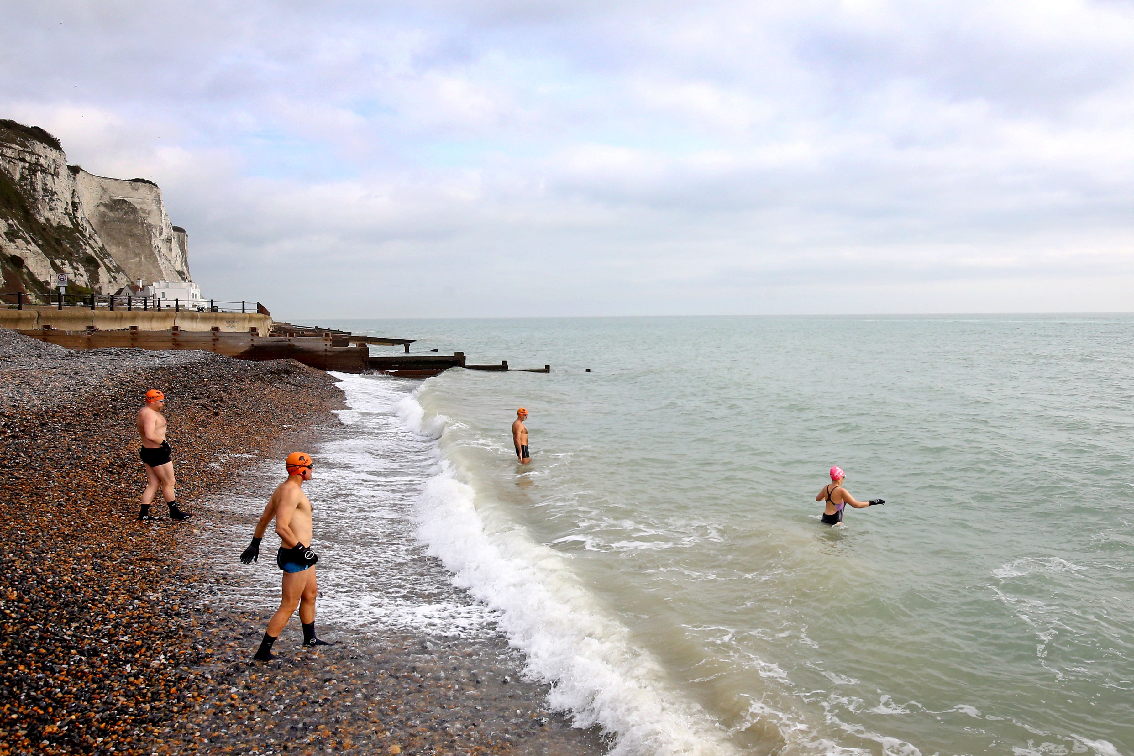 Swimmers in February near Dover, Kent (Gareth Fuller/PA)