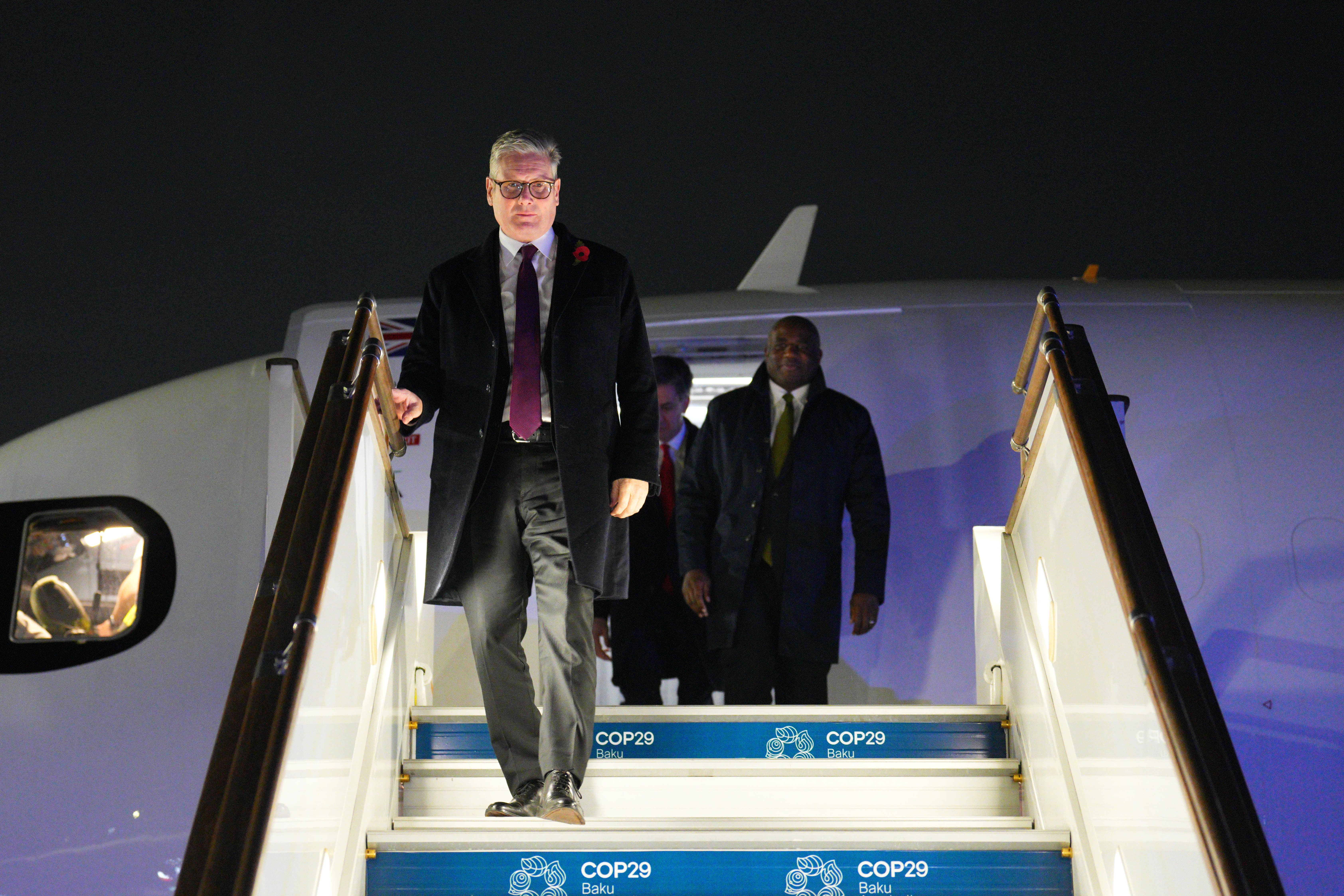 Prime Minister Sir Keir Starmer (left) and Foreign Secretary David Lammy arrive at Heydar Aliyev International Airport to attend the Cop29 climate summit in Baku, Azerbaijan (Carl Court/PA)