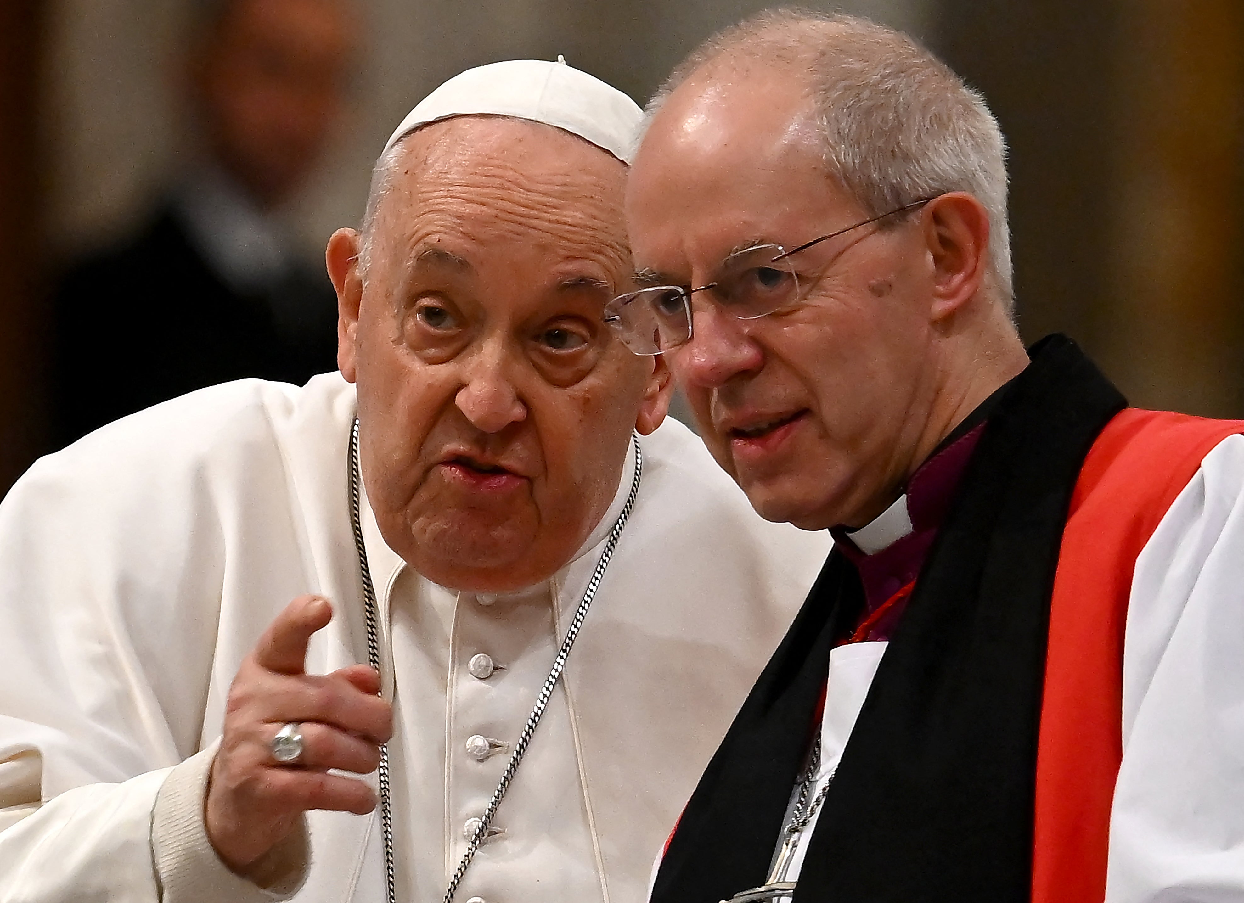 Pope Francis (L) speaks with the archibishop of Canterbury Justin Welby (R) during the celebration of vespers, on the solemnity of the conversion of Saint Paul, in the Basilica of St. Paul Outside The Walls in Rome on January 25, 2024