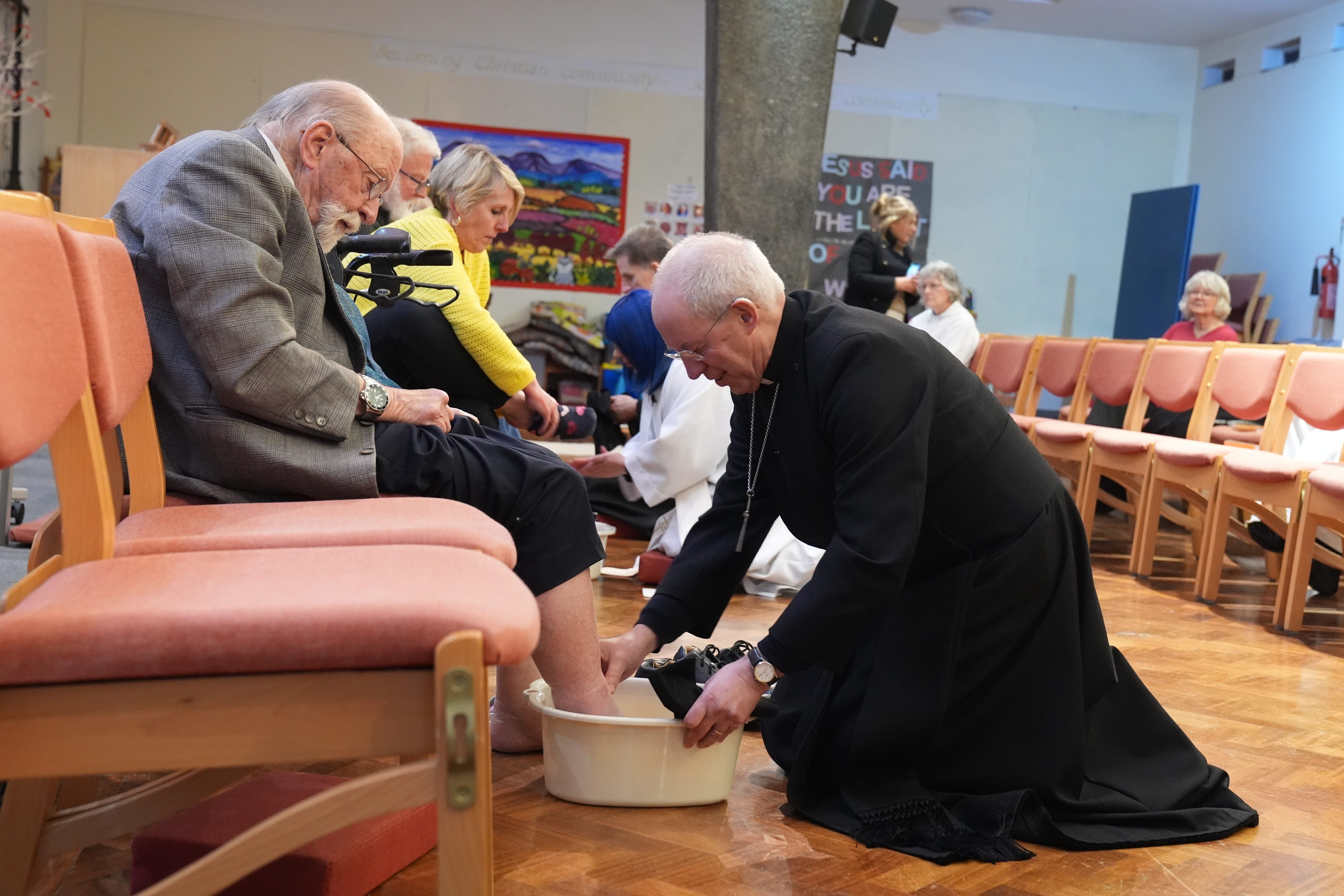 Archbishop of Canterbury Justin Welby performs the Washing of the Feet ceremony during the Sung Eucharist, The Liturgy of Maundy Thursday service at St Paul’s Church, Maidstone (Gareth Fuller/PA)