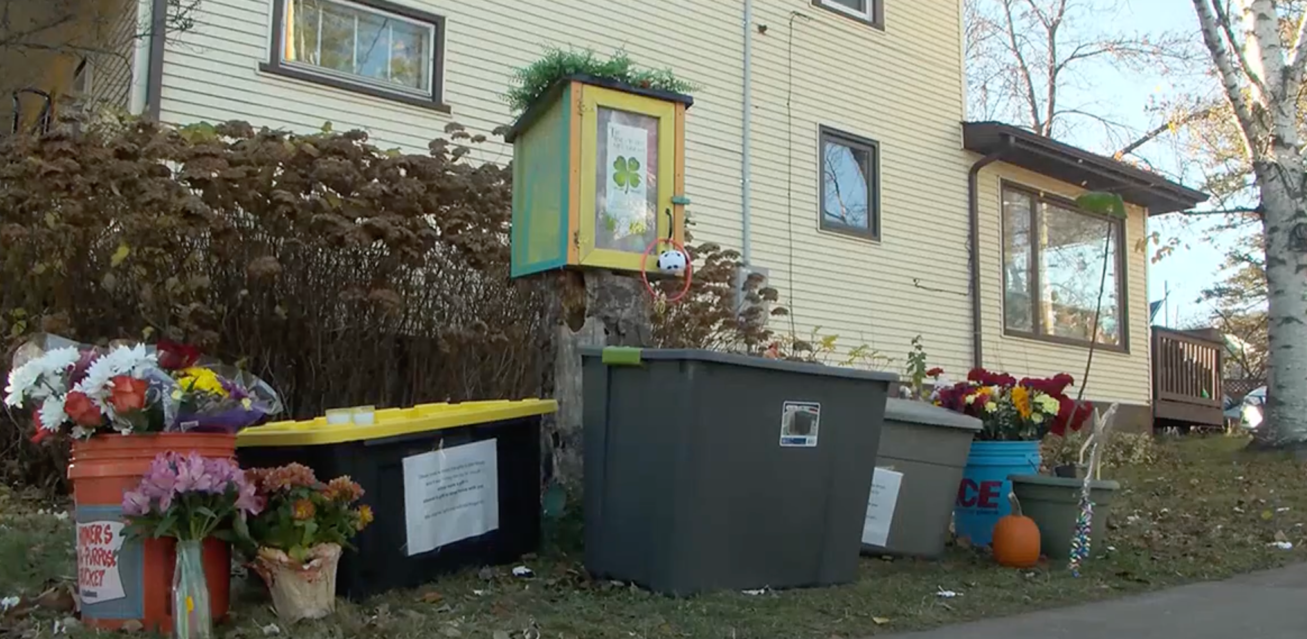 Toys and floral tributes are left outside a ‘toy library’ made by seven-year-old Oliver Nephew, who was fatally shot by his father on November 5